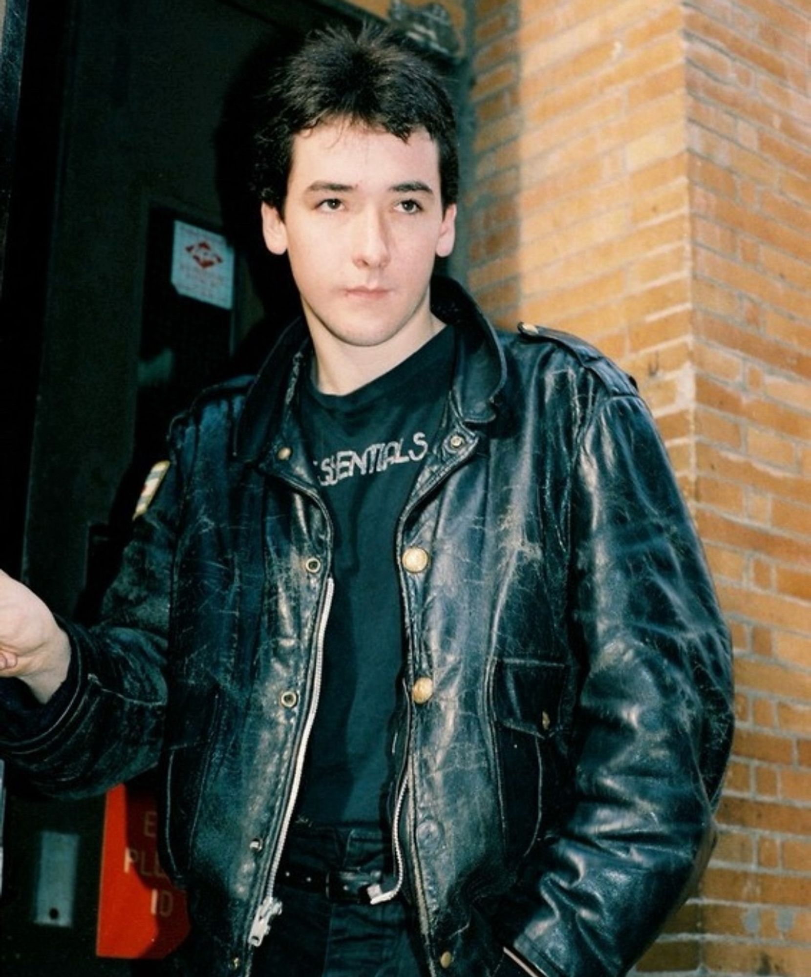 A young John Cusack in a leather jacket