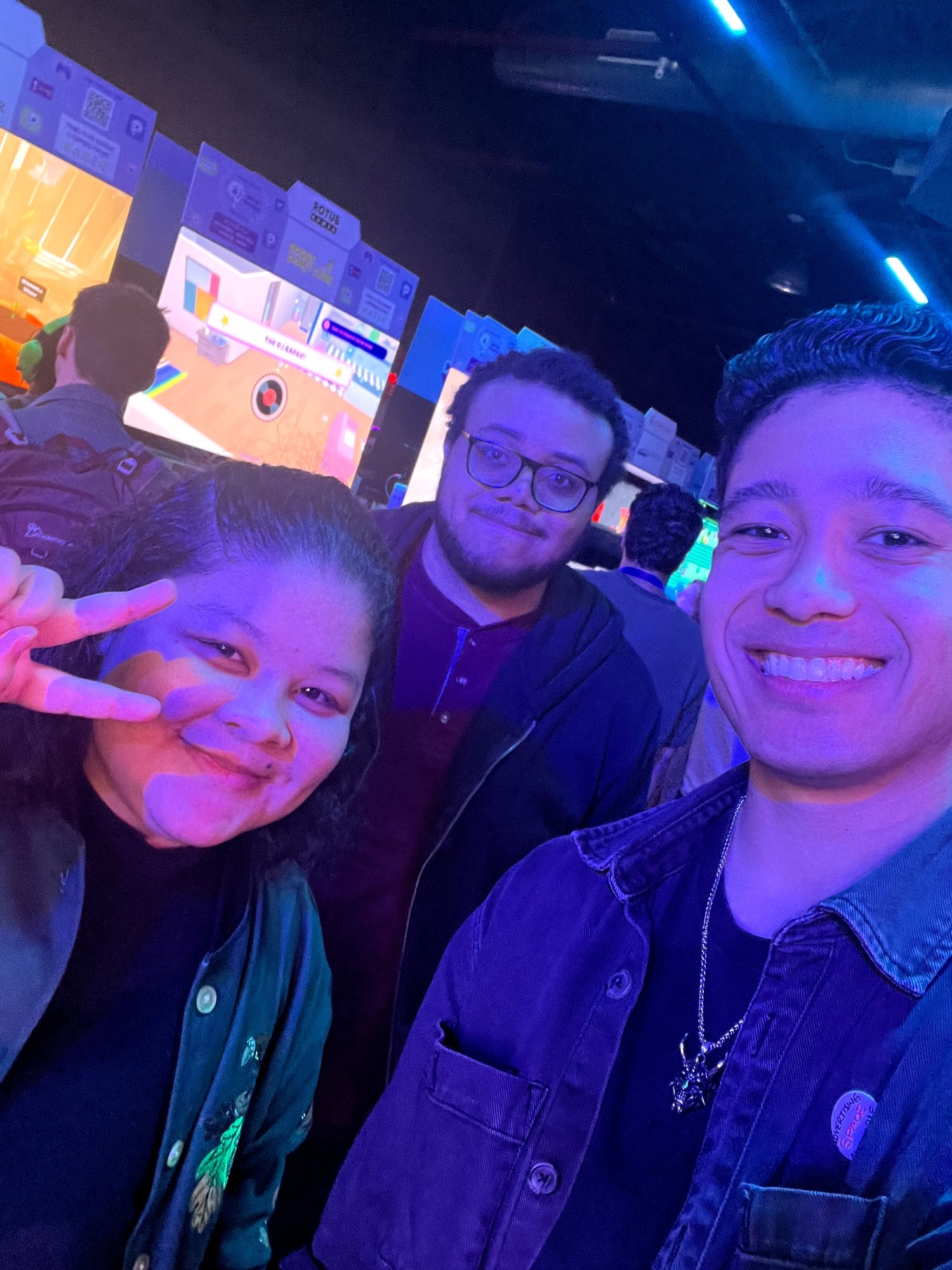 Selfie of some of the Studio Hitsuji team under the spooky purple lights at the DayOfTheDevs indie showcase event