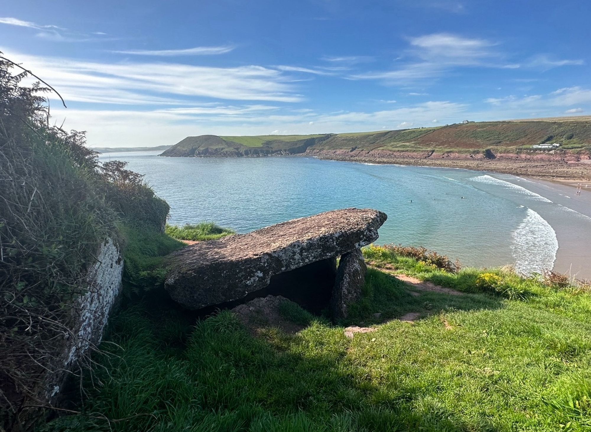 A final angle, standing further away to show the view of the bay and beach.