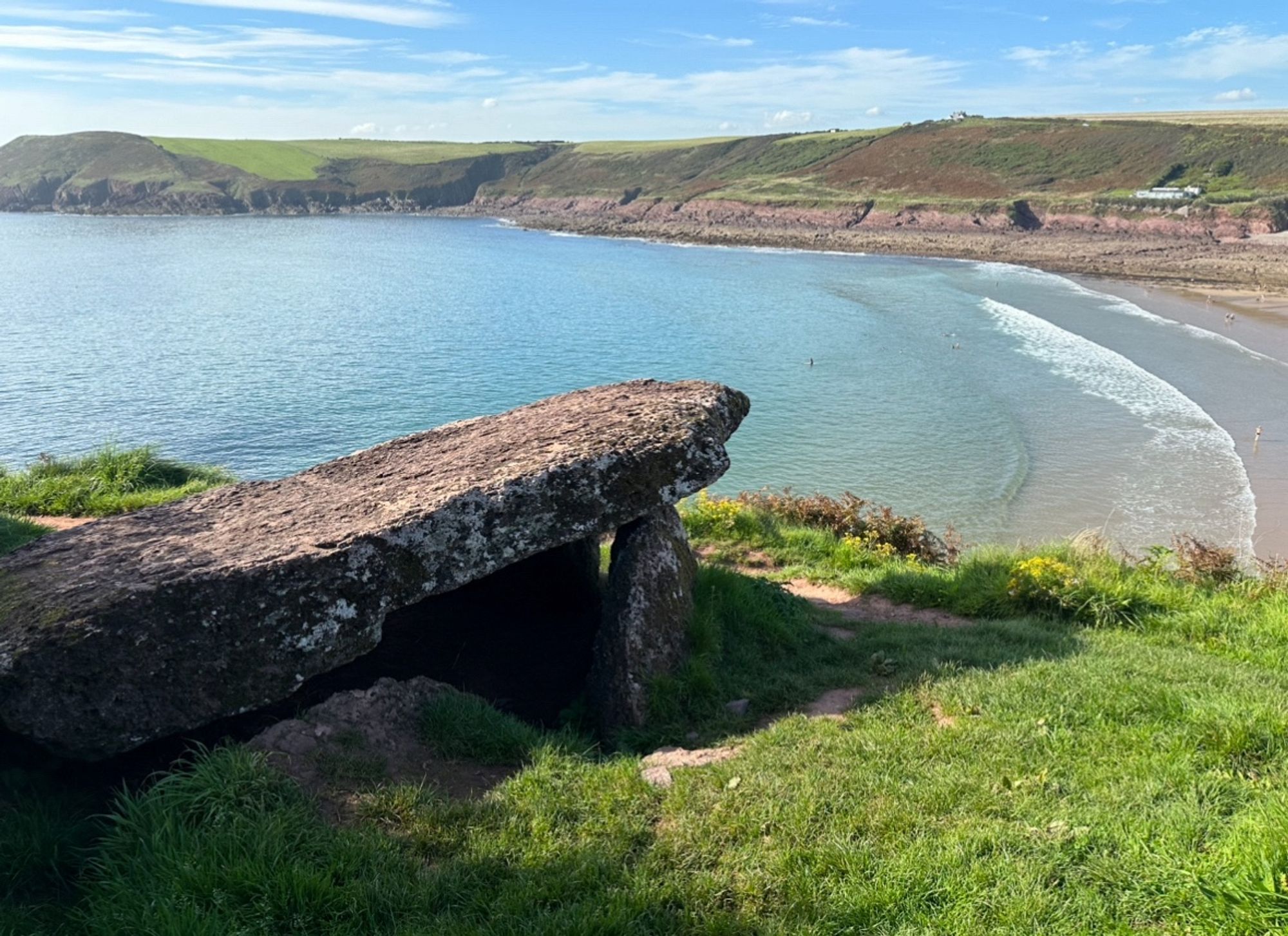 Another angle of the tomb more from behind with gentle waves lapping at the beach.