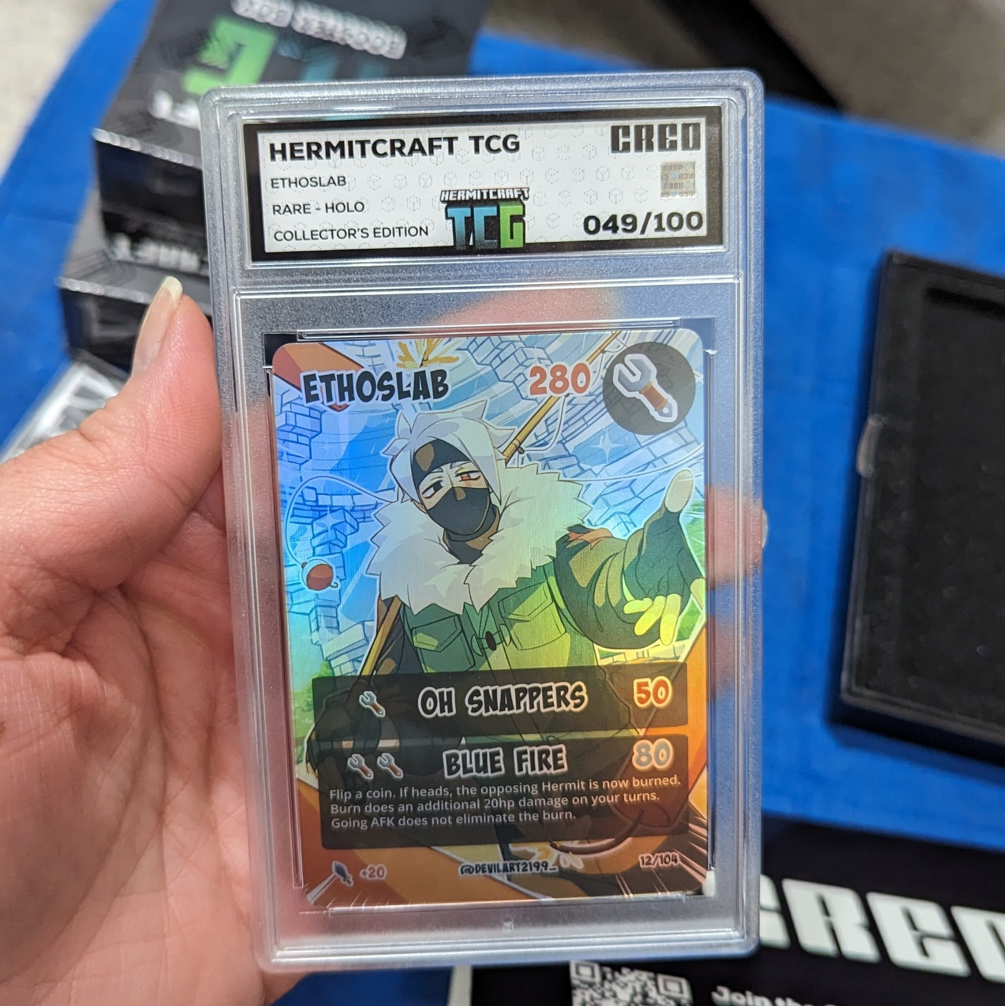 Showing a shiny rare collector's edition Hermitcraft TCG card of Etho