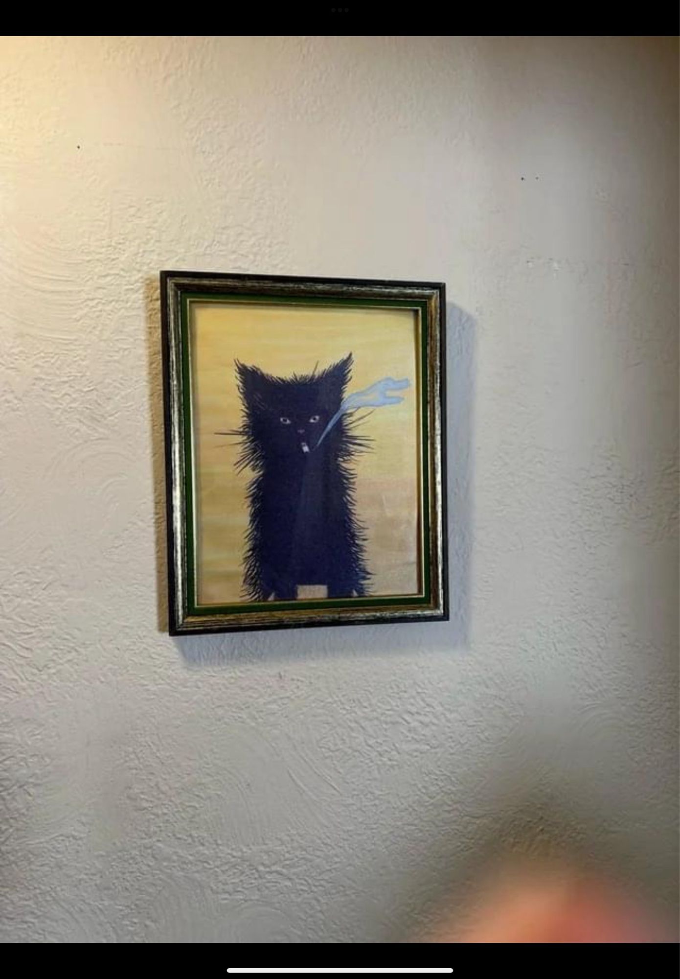 Painting of a black cat smoking a cigarette.