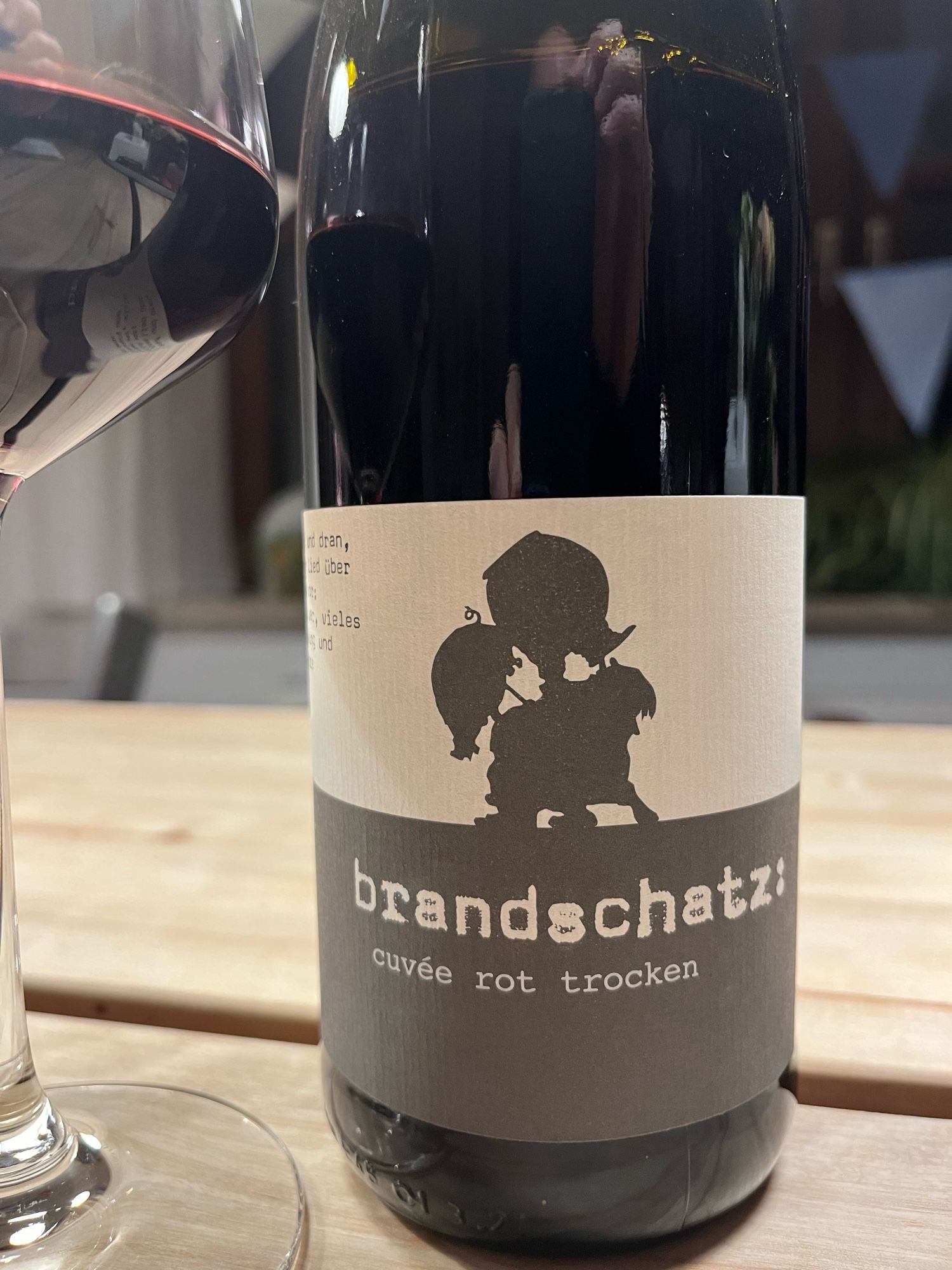 A red wine bottle: “brandschatz”. In German this means to pillage (brandschatzen) and the treasure of a pillage.