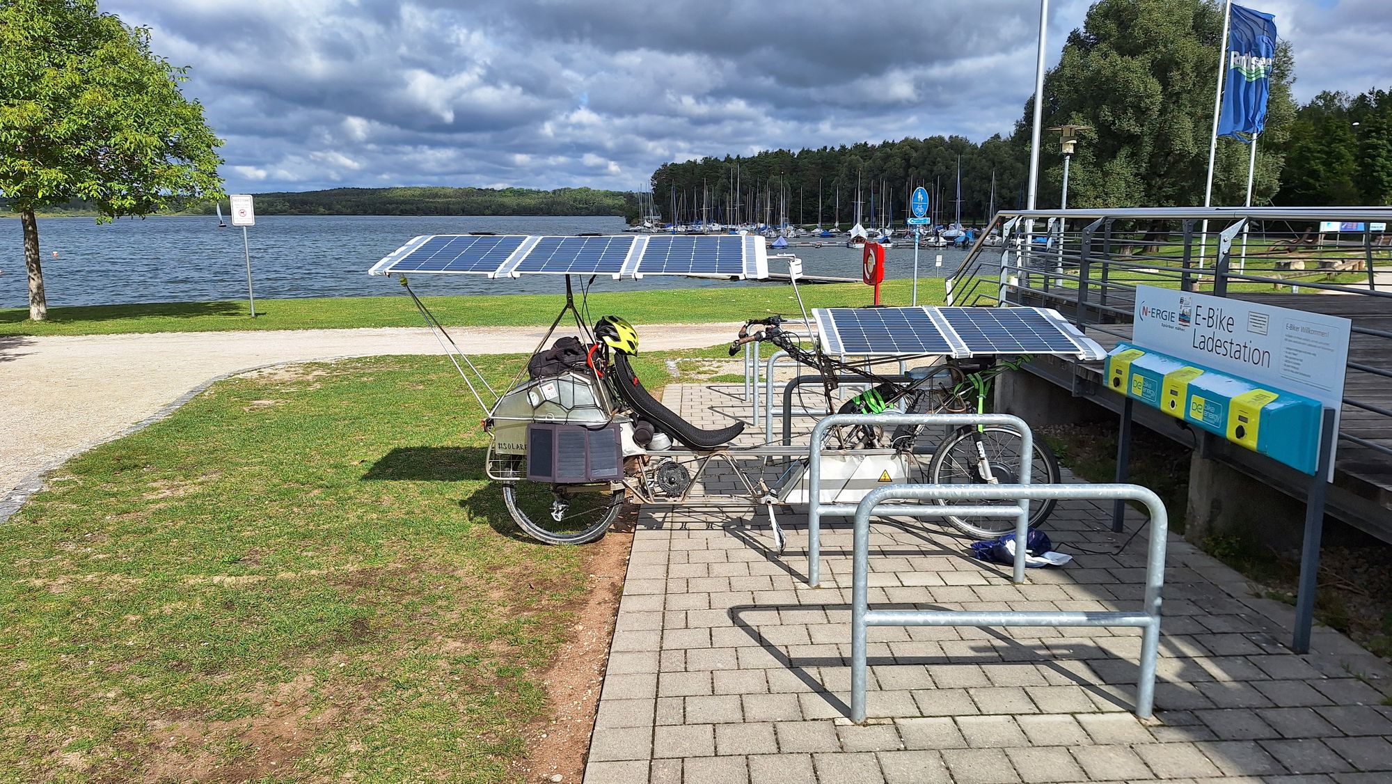 Solar bike being supercharged both by sun and from grid