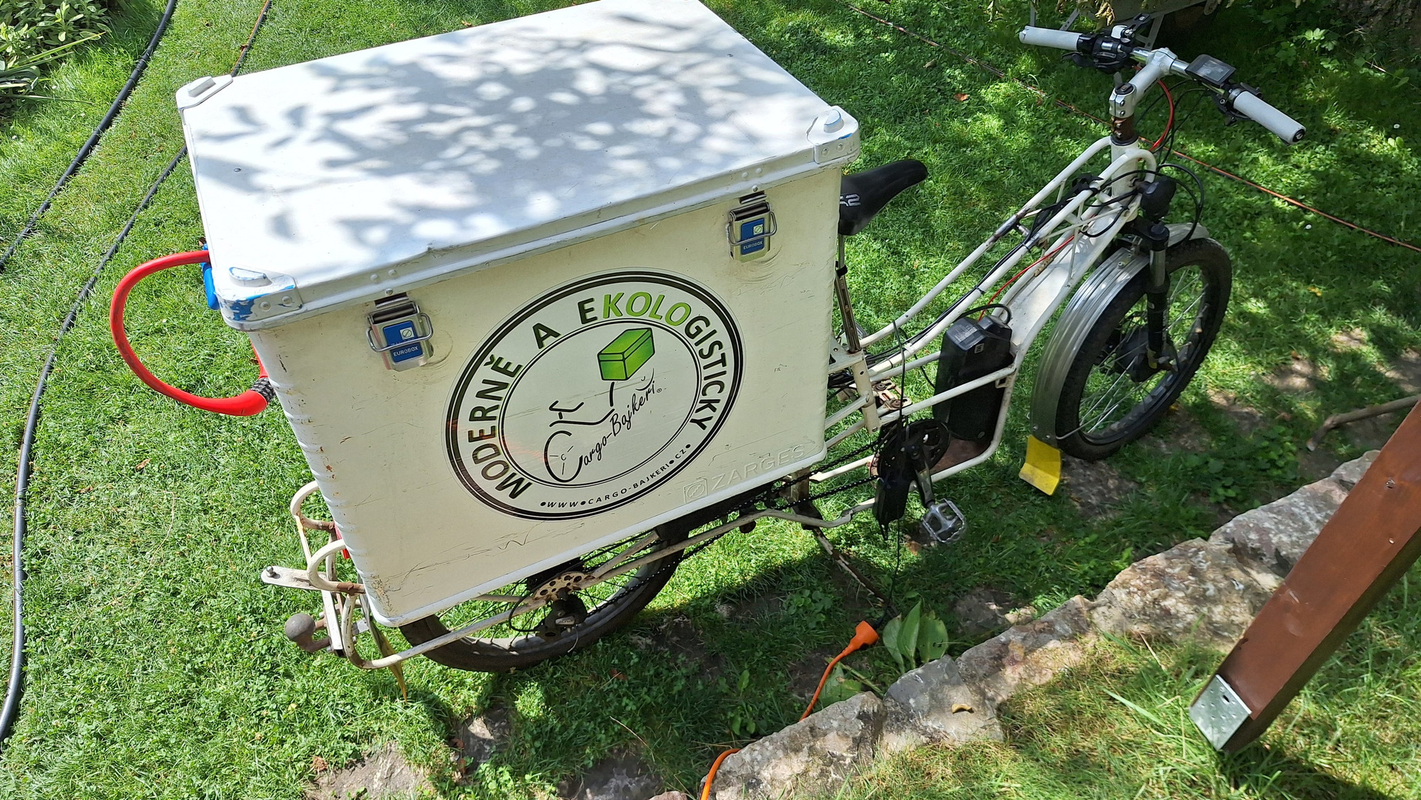 Cargobike being charged outdoor.