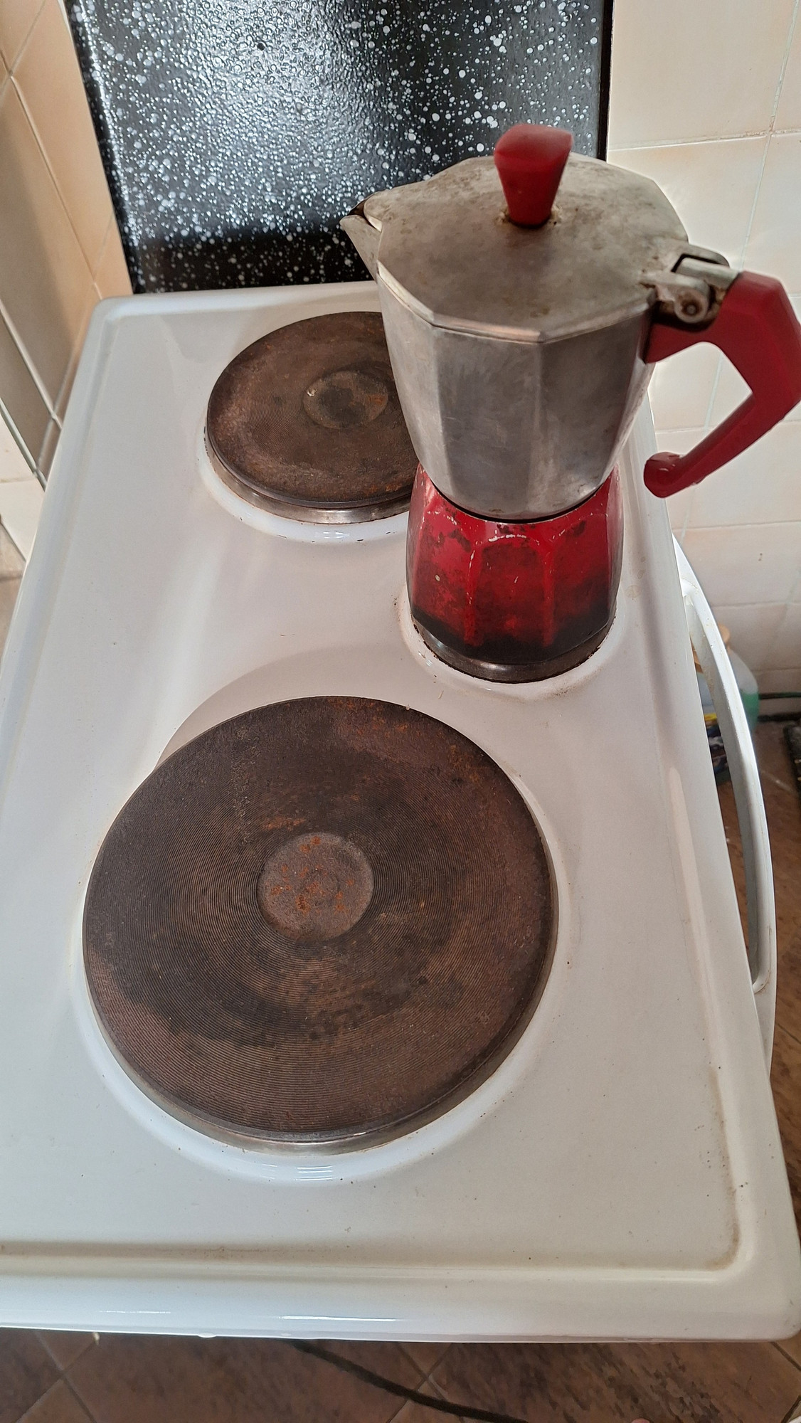 Just a red coffee mocca pot on used electric  stove.