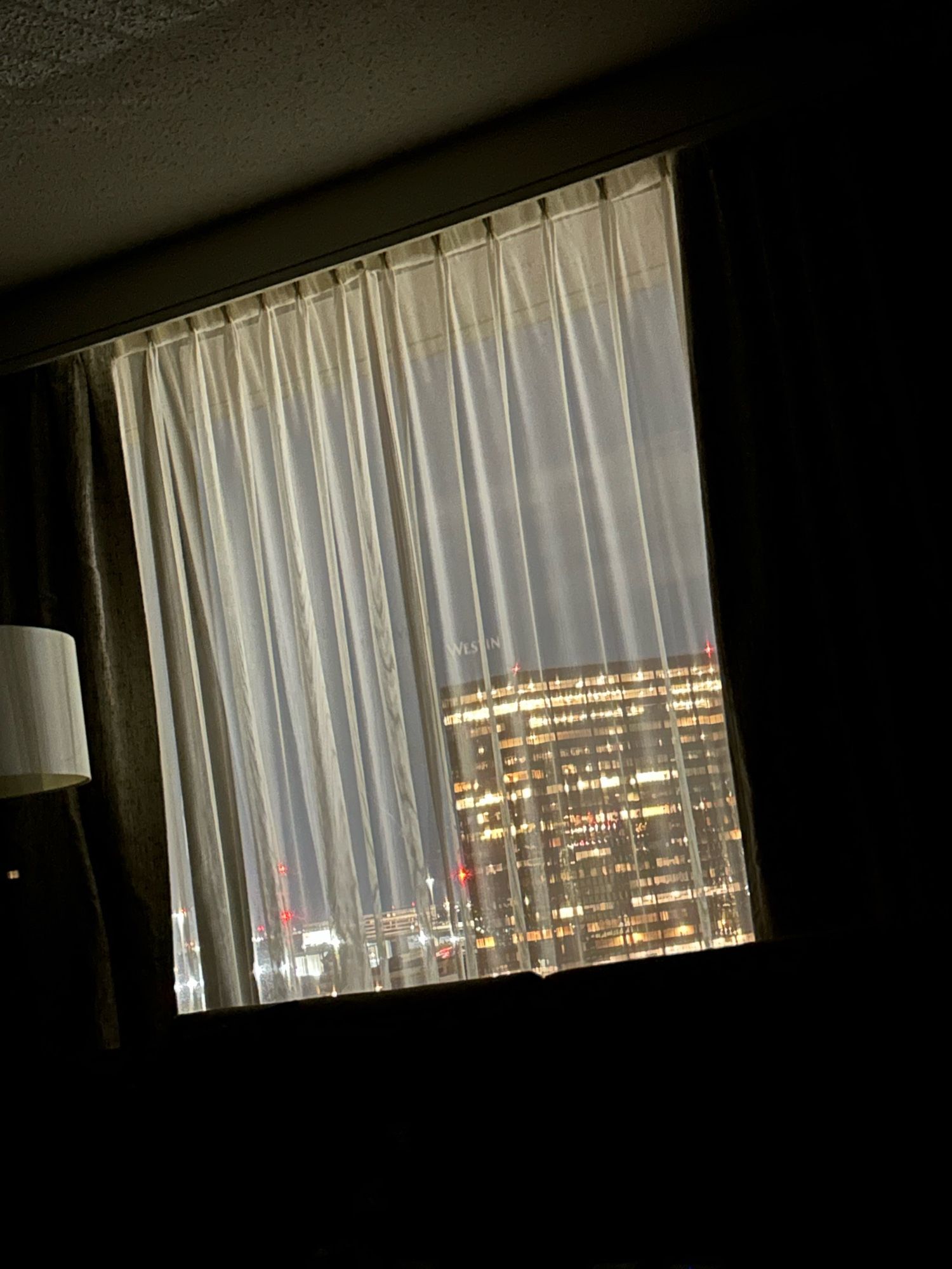 A photo of the view outside my hotel room. Except I was too tired to get up so it’s a picture of the closed window sheers, taken from the other side of the room