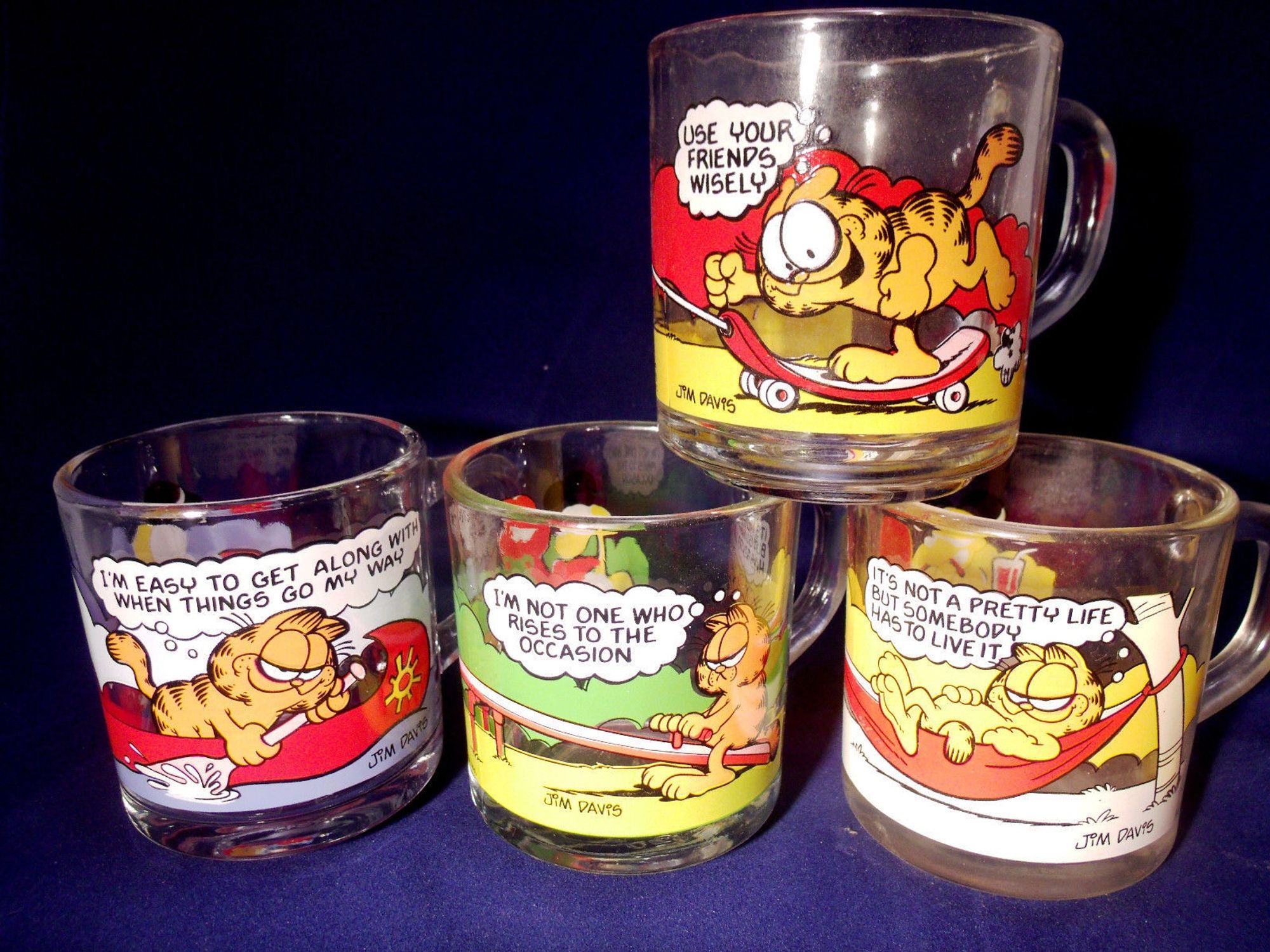 Set of four Garfield McDonalds happy meal mugs from the 80s, which have since been revealed to have dangerous levels of cadmium