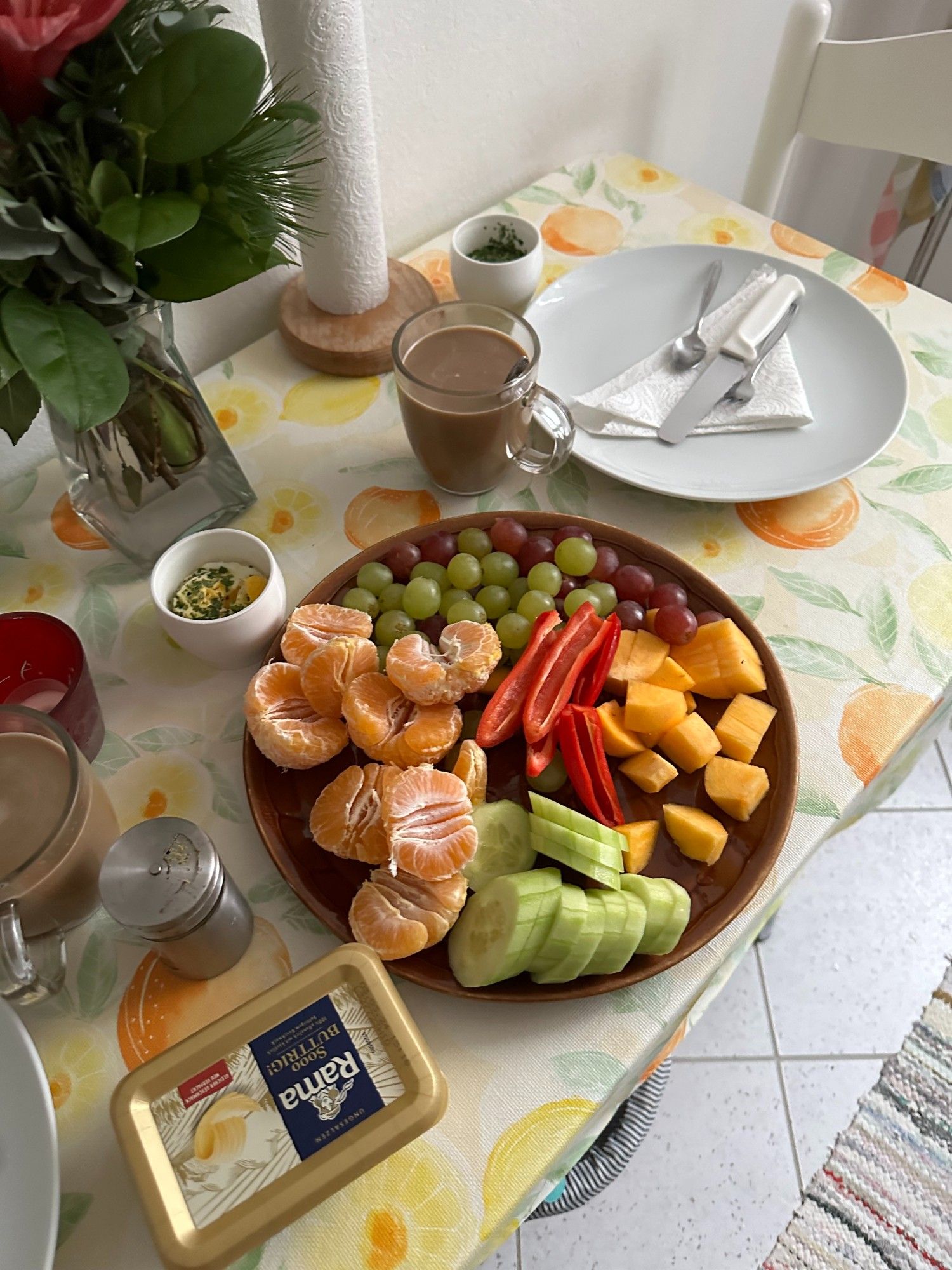 Breakfasttable with fruits & veggies. Microwave eggs, coffee.