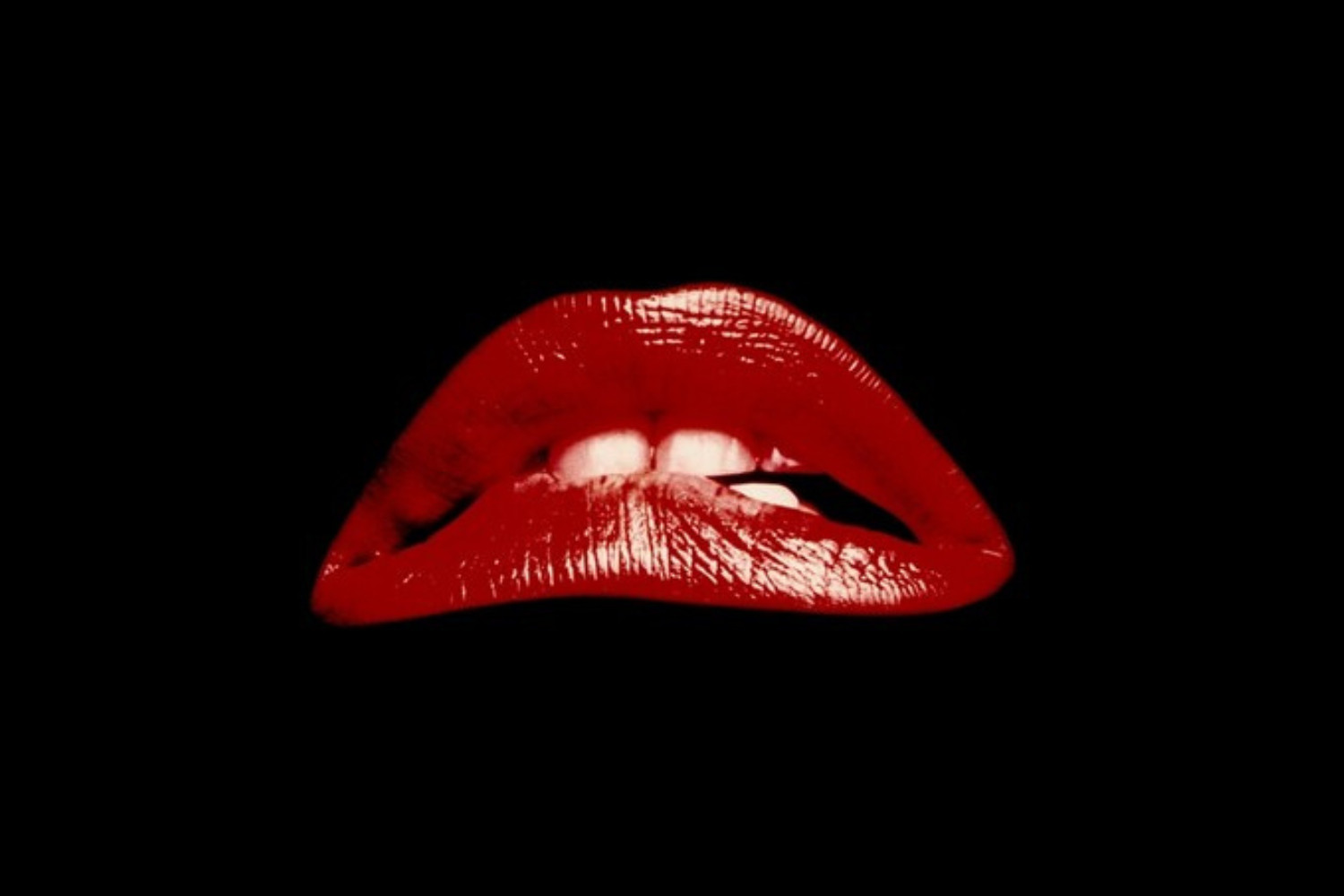 Red, disembodied lips set against a back background, known to be the poster symbol of THE ROCKY HORROR PICTURE SHOW. 
