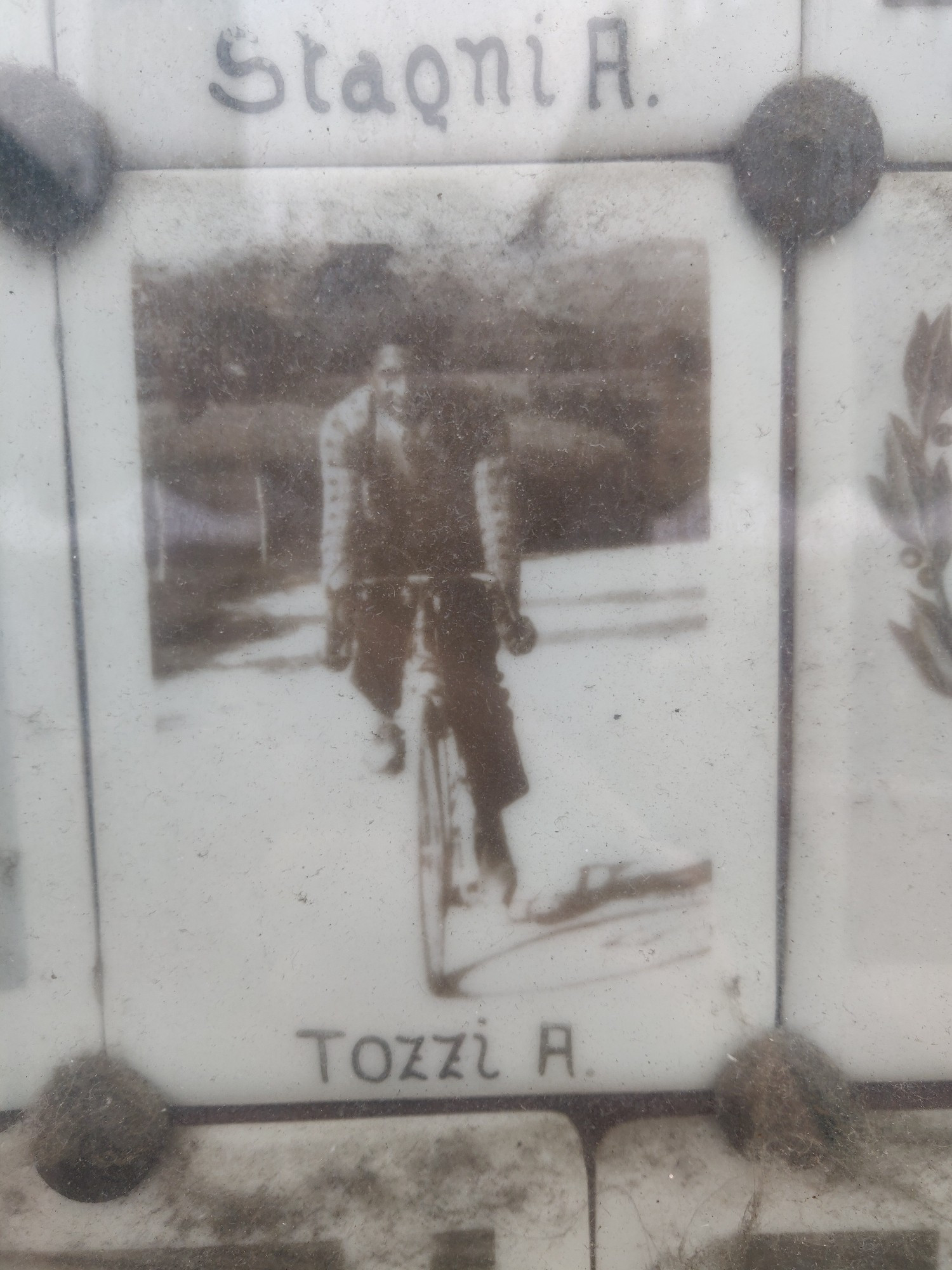 A picture of one of the heroes A. Tozzi, smiling and riding his bicycle.