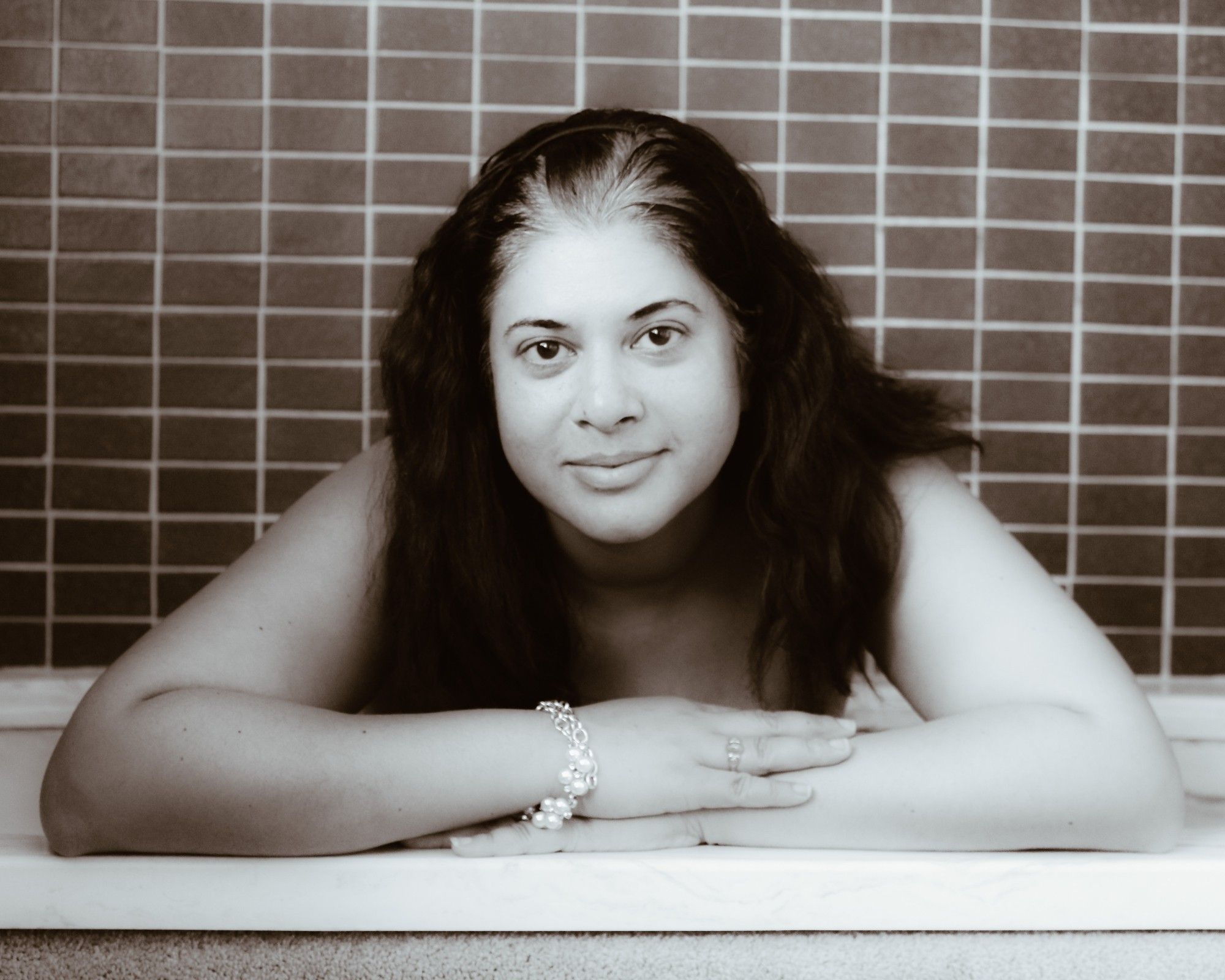 An implied nude portrait of Jolie in her bathtub