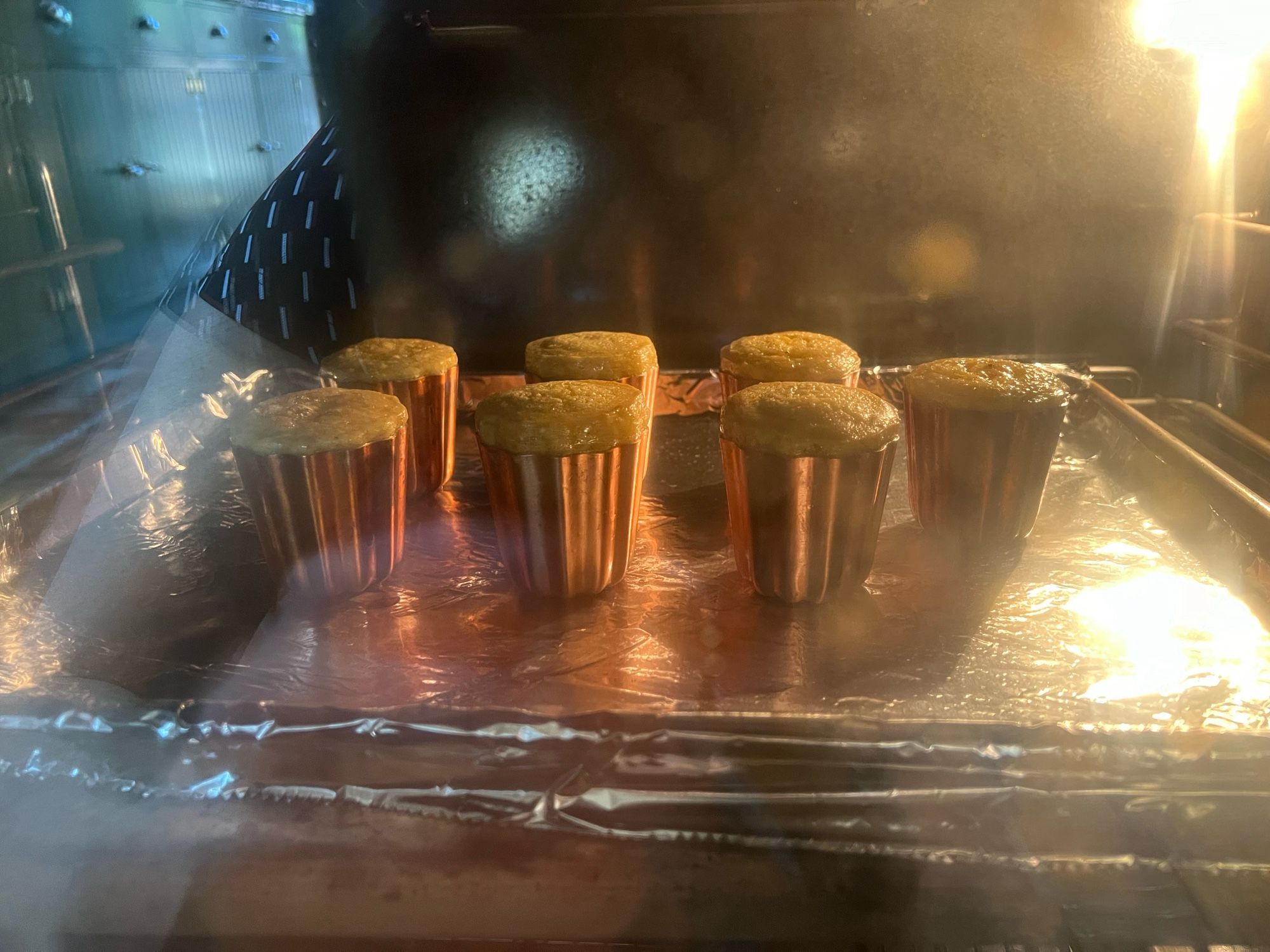 Pictures of candles baking in oven.