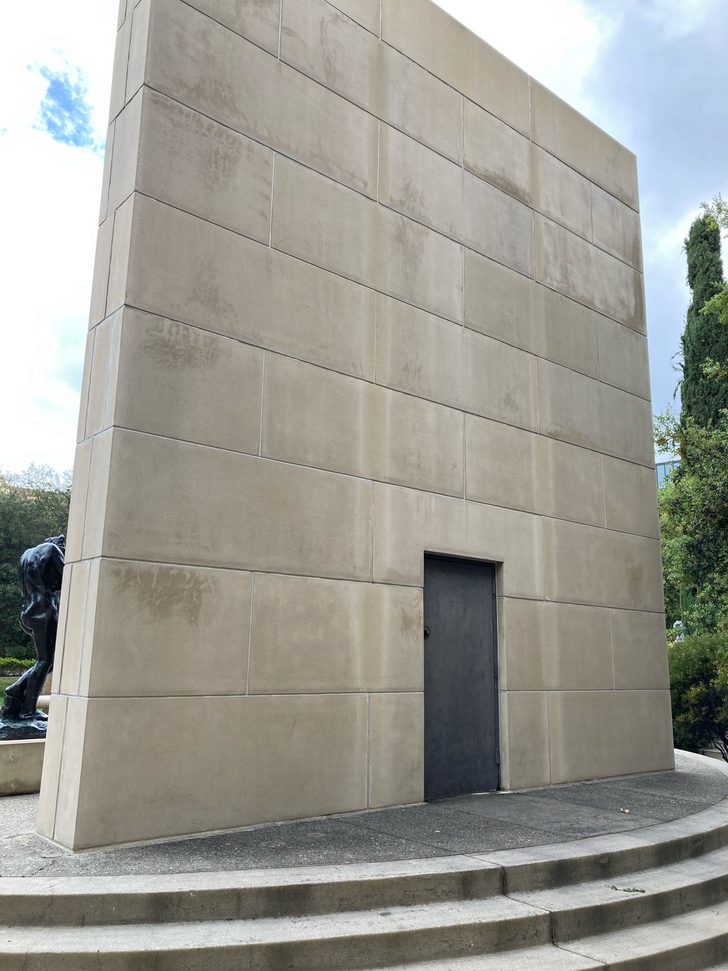 The back of the wall holding The Gates of Hell which includes its own door.