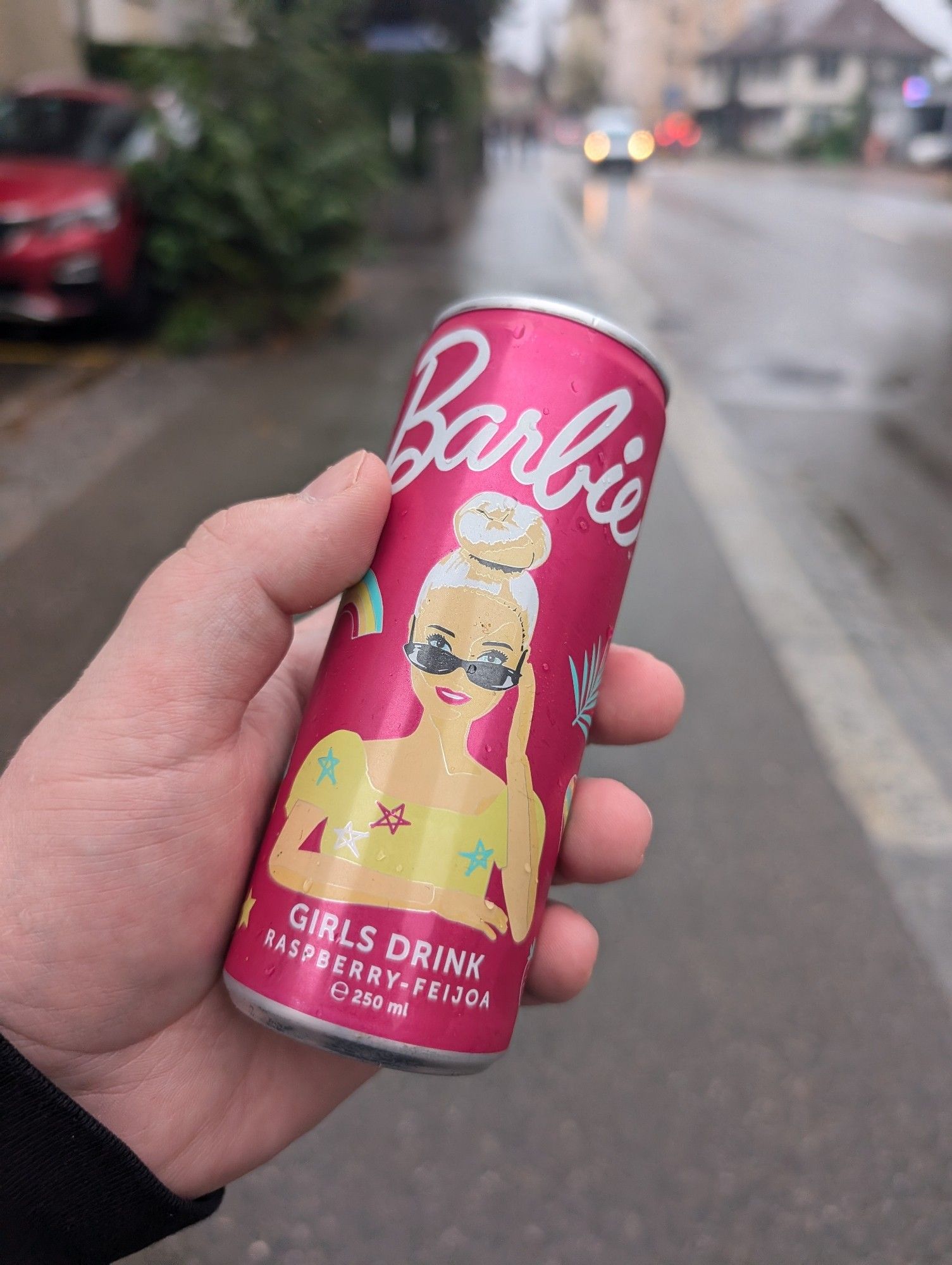 photo of a pink barbie branded can of a drink called "girl drink"