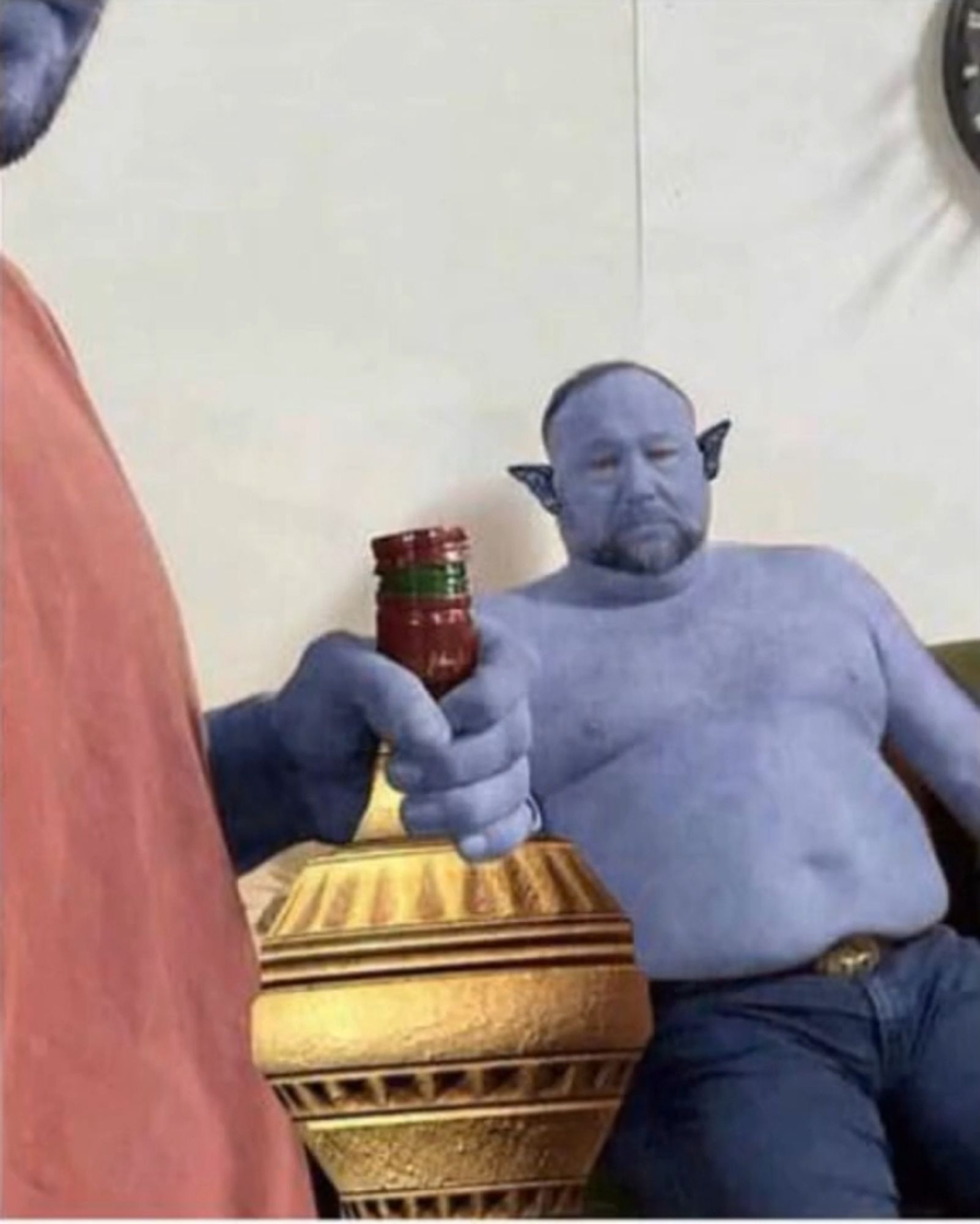 Dunmer Alex Jones sad on a couch