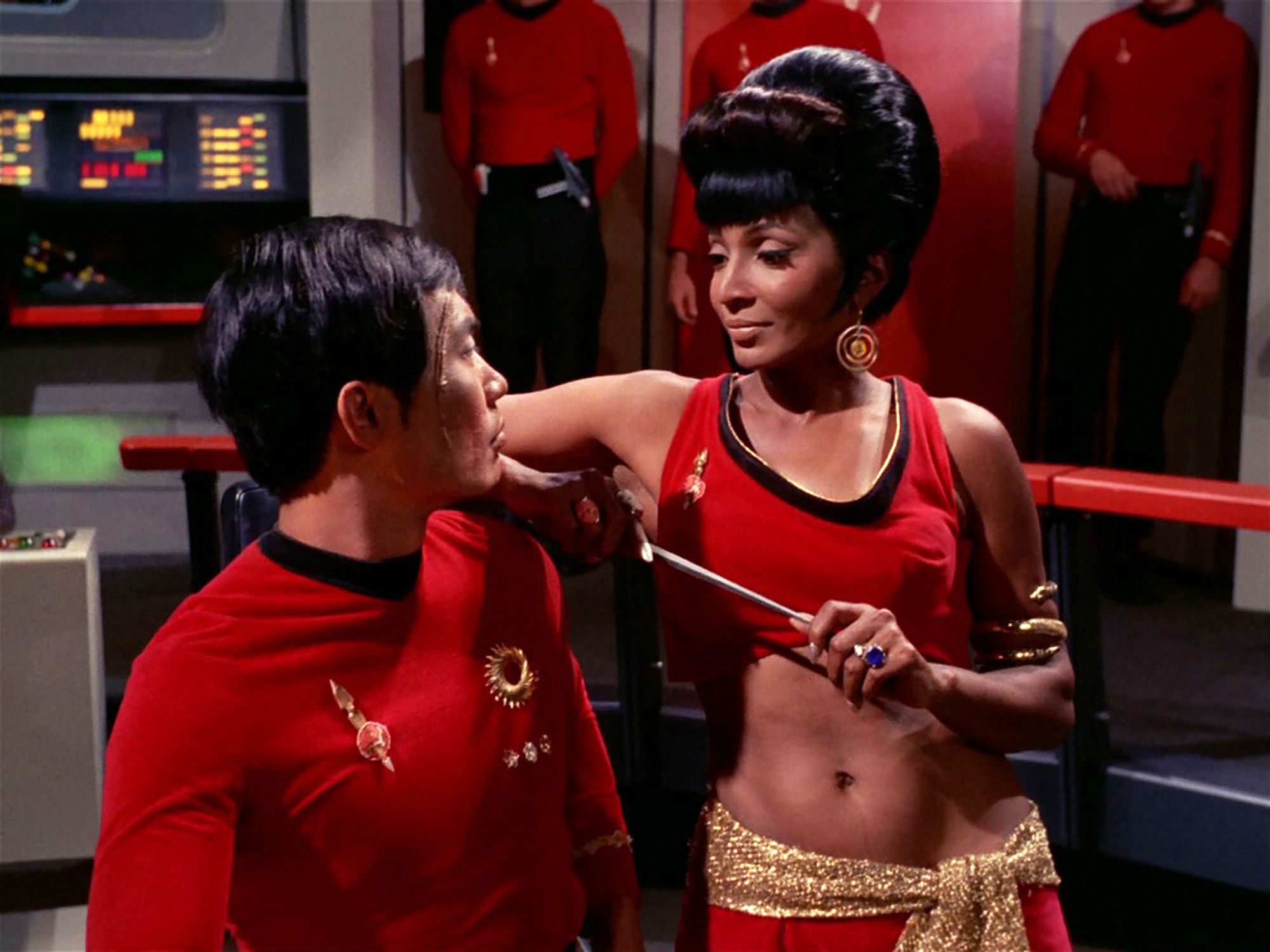 Scene from Star Trek episode "Mirror Mirror" where Uhura holds a dagger to Sulu's neck.