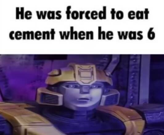 A screenshot of B-127 from Transformers One with a sad face. Caption (white with black text) reads as "He was forced to eat cement when he was 6"