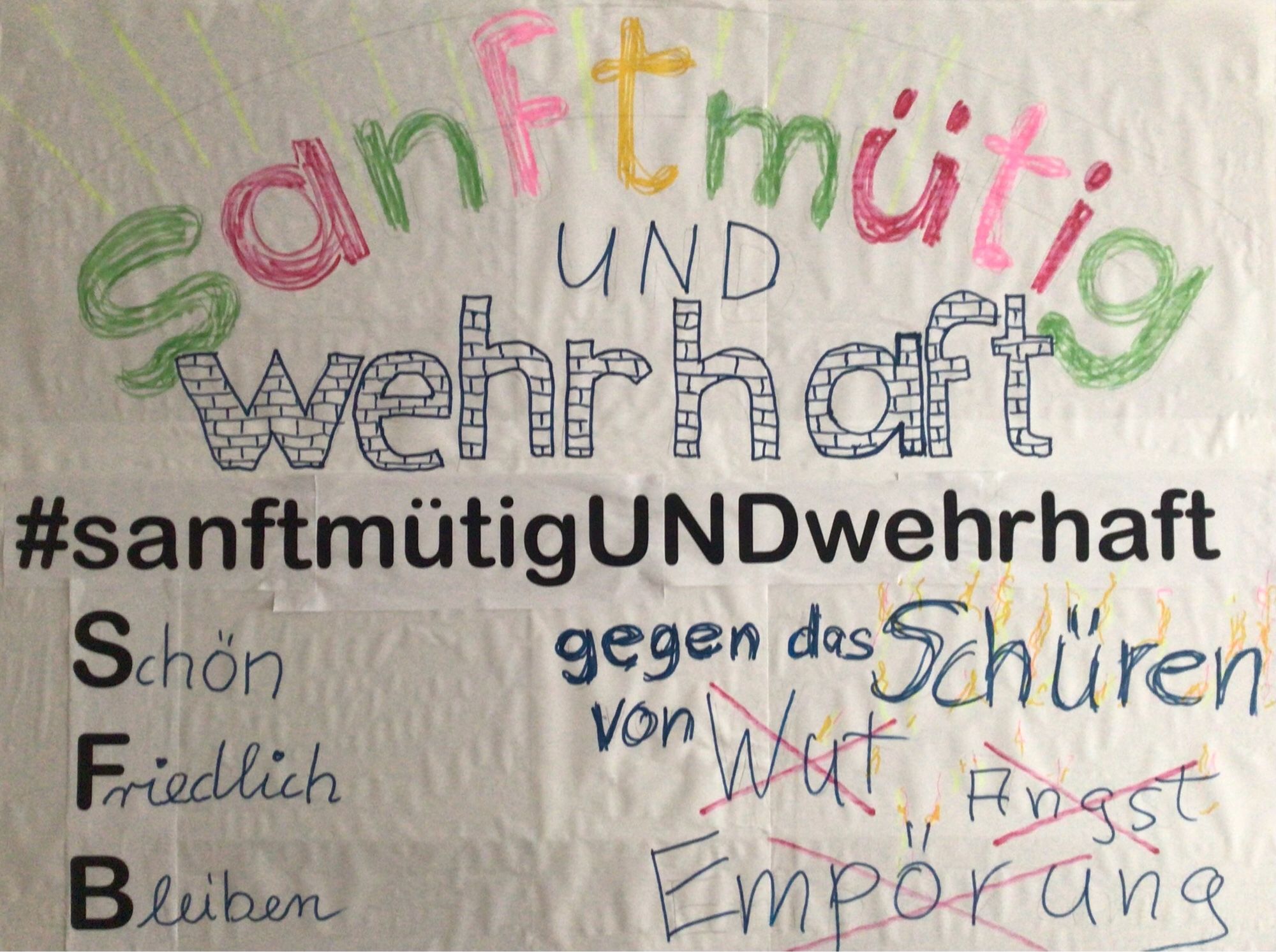 Plakat mit Text: „sanftmütig und wehrhaft gegen das Schüren von Wut, Angst, Empörung“