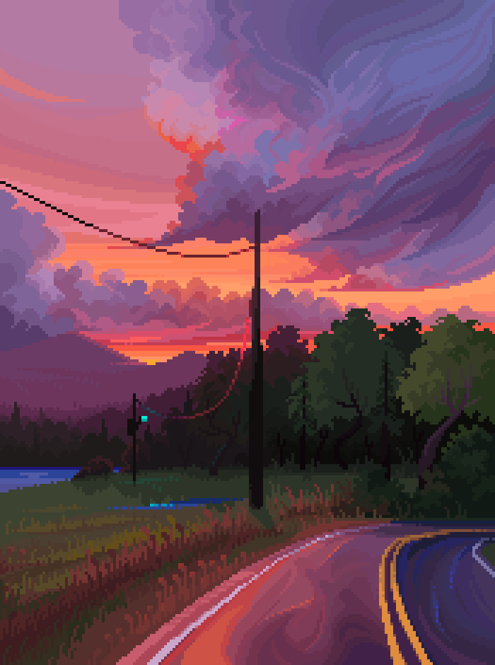 a sunset reflected off of an asphalt road overlooking a field with powerlines, and a lake with mountains in the background.