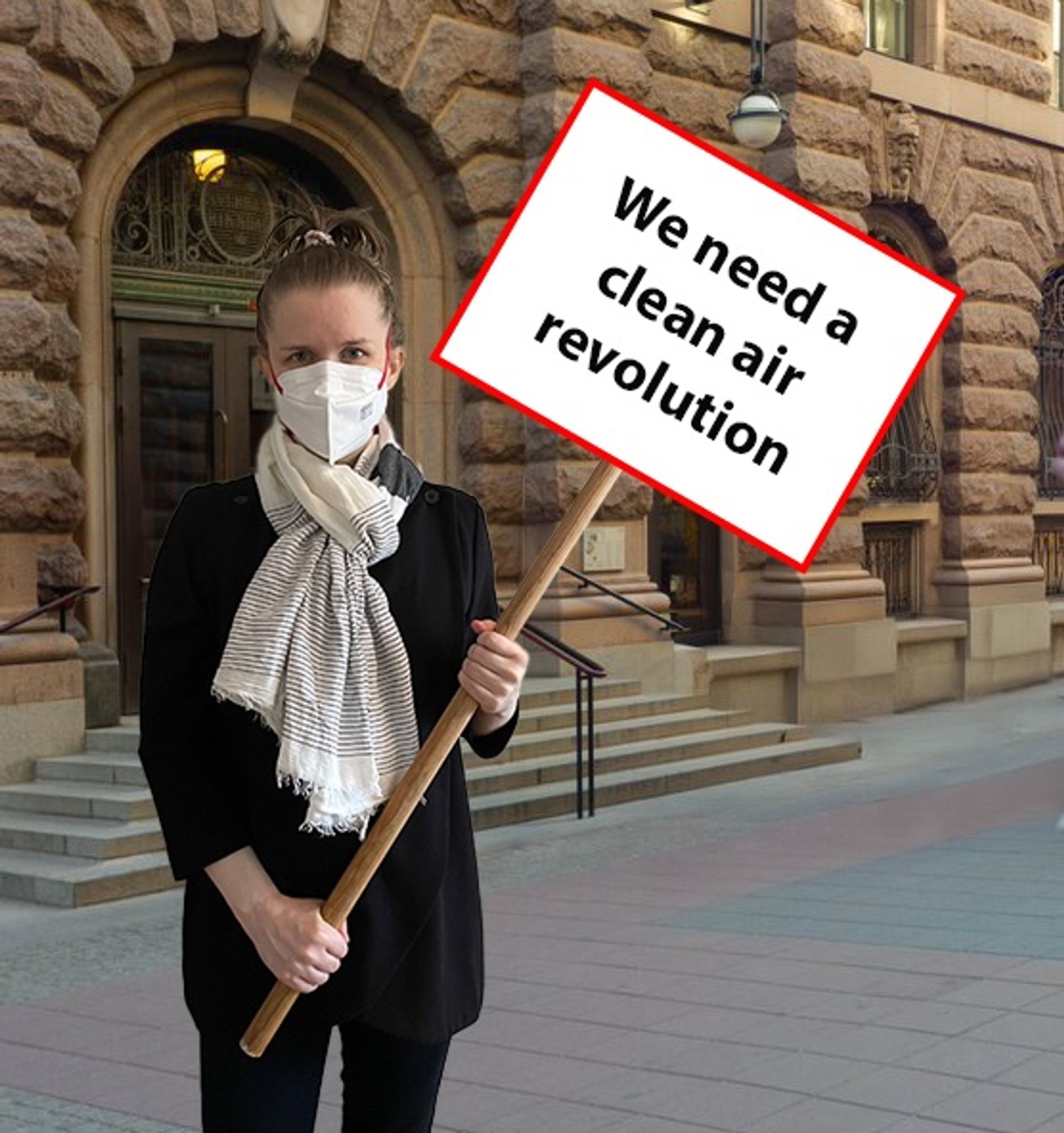 A photoshopped image of me standing outside the Swedish parliament, wearing a respirator and holding a sign saying ”We need a clean air revolution”.