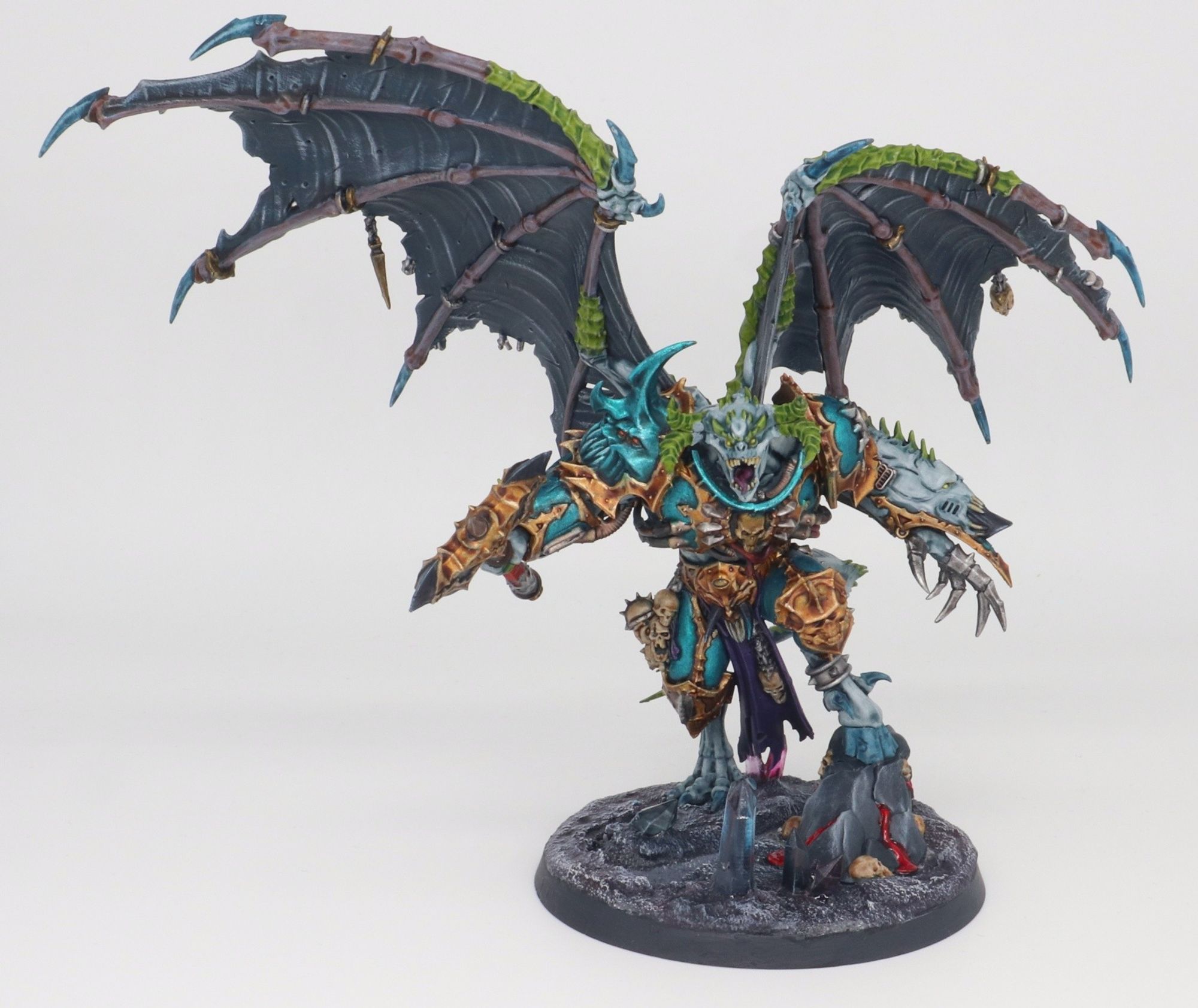 A Warhammer 40,000 Chaos Space Marines model. A Daemon Prince, with wings, of the Alpha Legion.