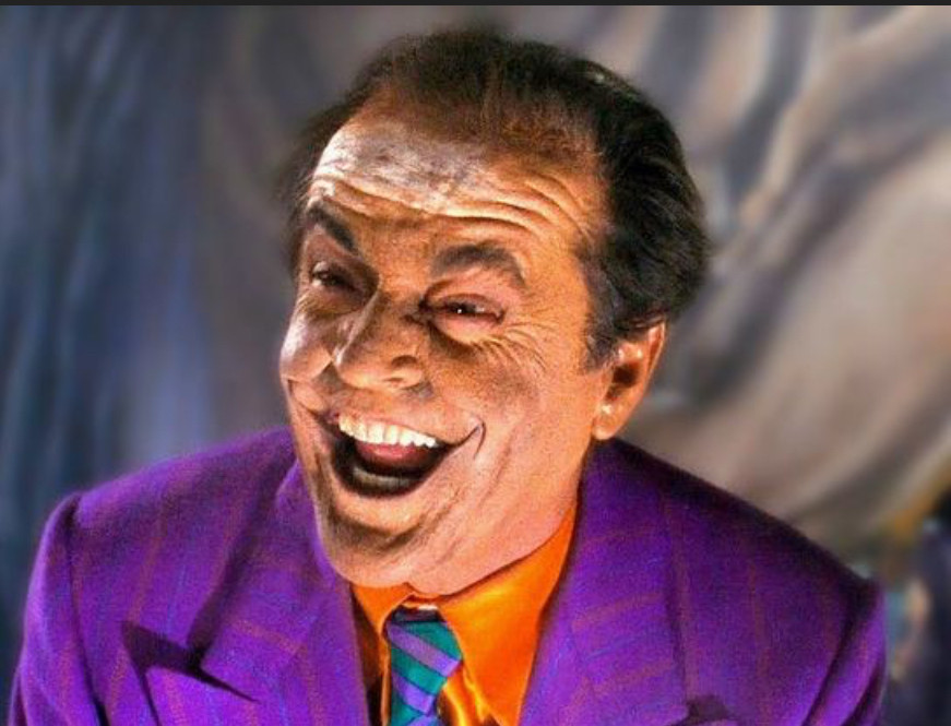 1989 Batman movie- the Joker’s flesh-toned makeup is smeared to reveal underlying chalk-white skin. The Joker is maniacally laughing