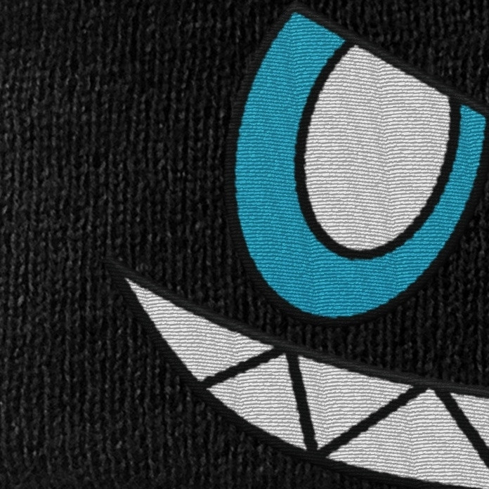 A sneak peak of a dark chao face embroidered onto fabric