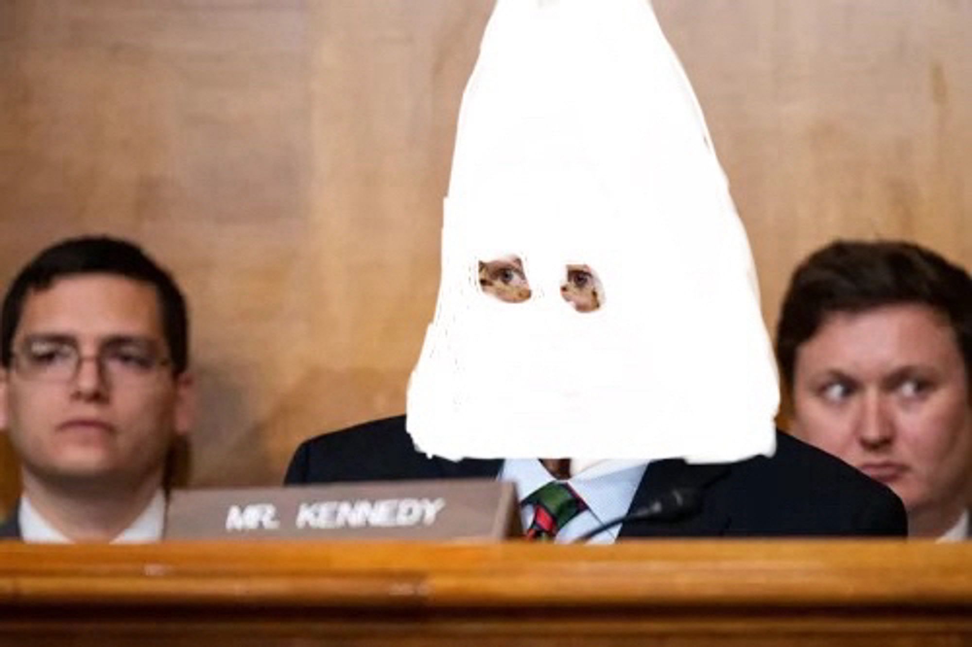 Sen. Kennedy (R-LA) with a crudely drawn klan hood over his head