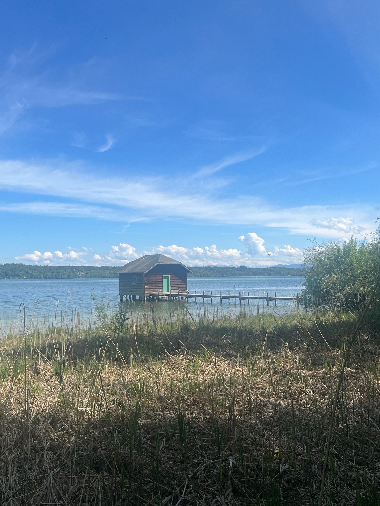 A view of a boathouse on a lake.