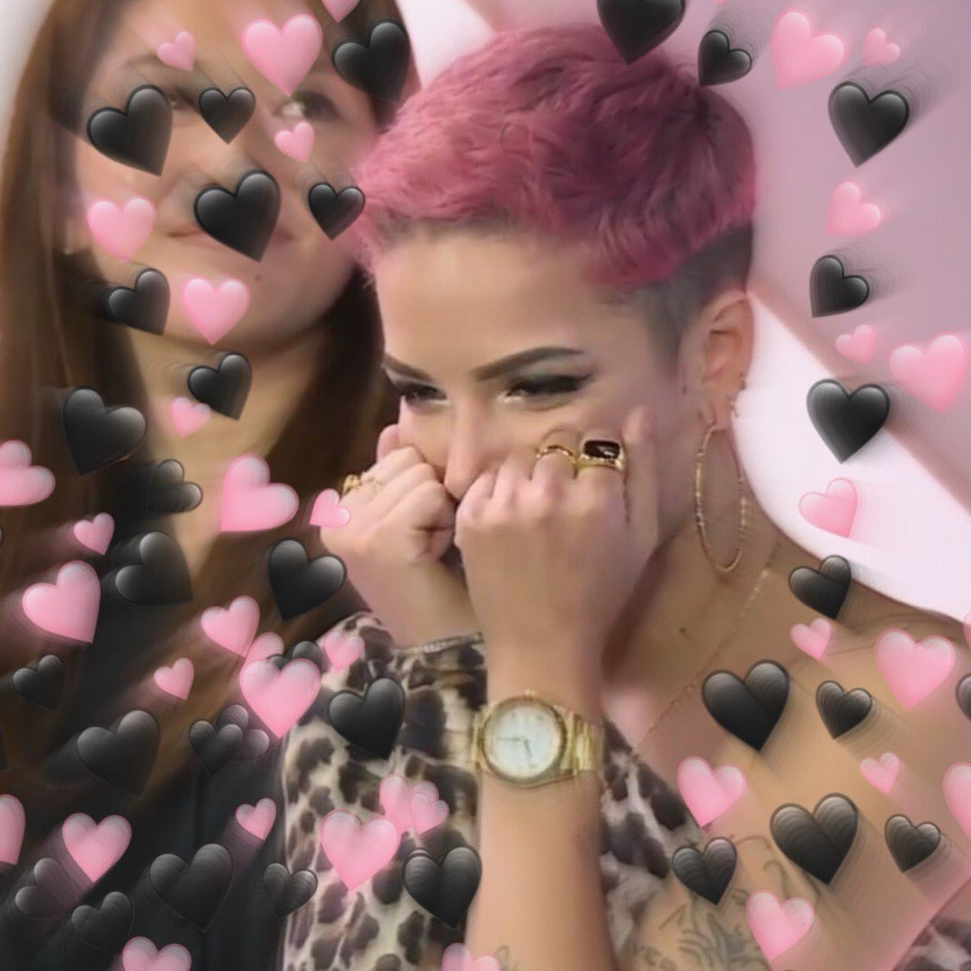 Excited Halsey surrounded by black and pink heart emoji speeding toward her