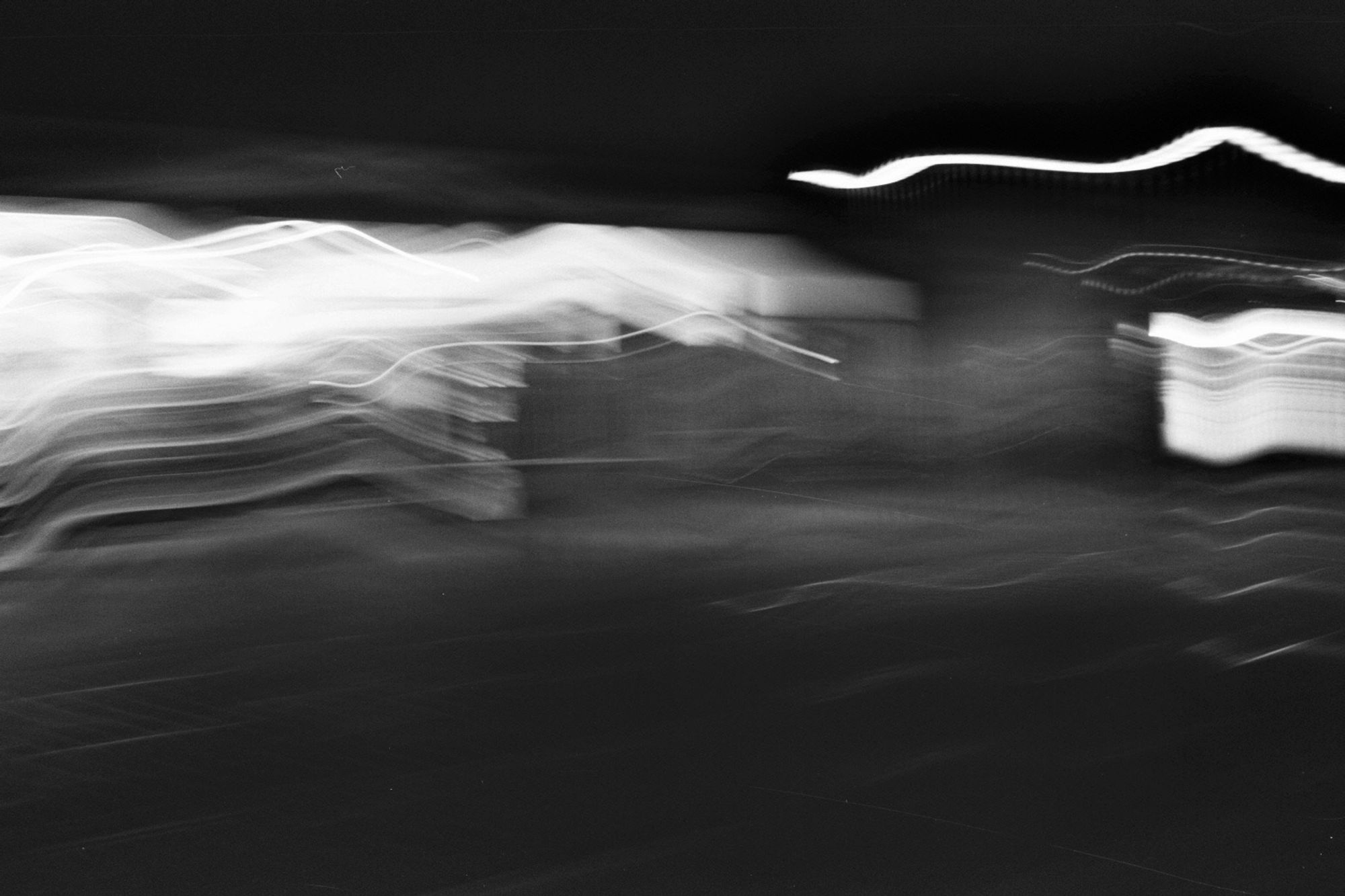 no thought. just being. flow.

a black and white photo of light streaks, wavelike.