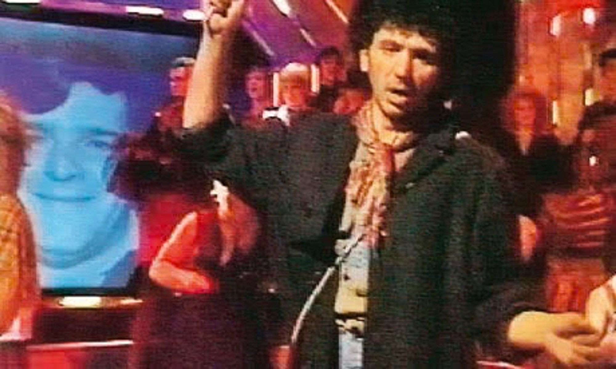 A picture of Jocky Wilson in the background of the performance of Jackie Wilson Said by Dexy’s Midnight Runners on Top Of The Pops, 30 September 1982.