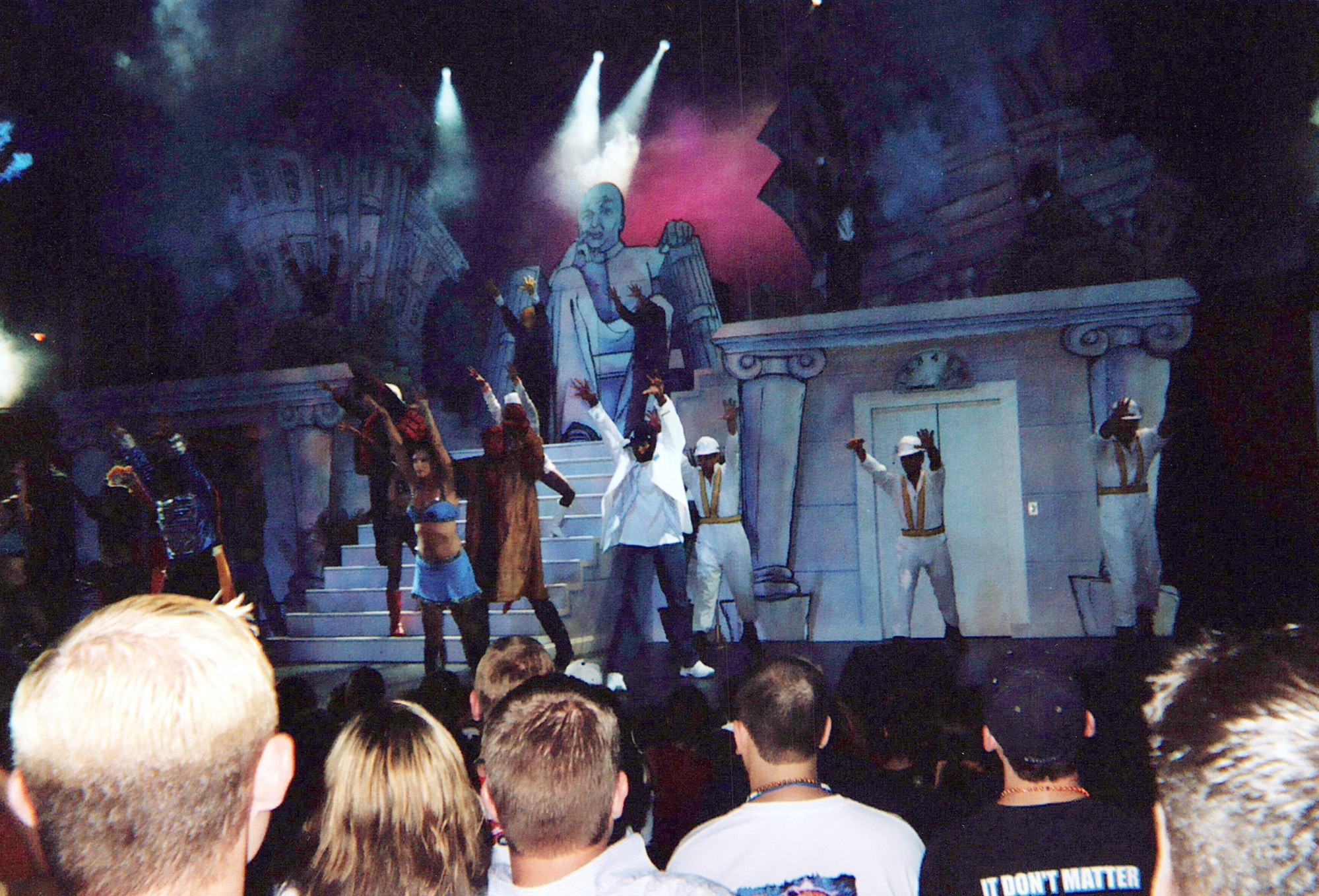 The finale dance from Bill and Ted. Performers dressed as various characters, including Prince, Hellboy, Usher, and the Beastie Boys, dance reaching into the air. The set behind them is a hand-drawn parody of the Lincoln Memorial. Only, it’s not Lincoln’s face—it’s the bald head of Dr. Evil from Austin Powers, pinky to the side of his lips.