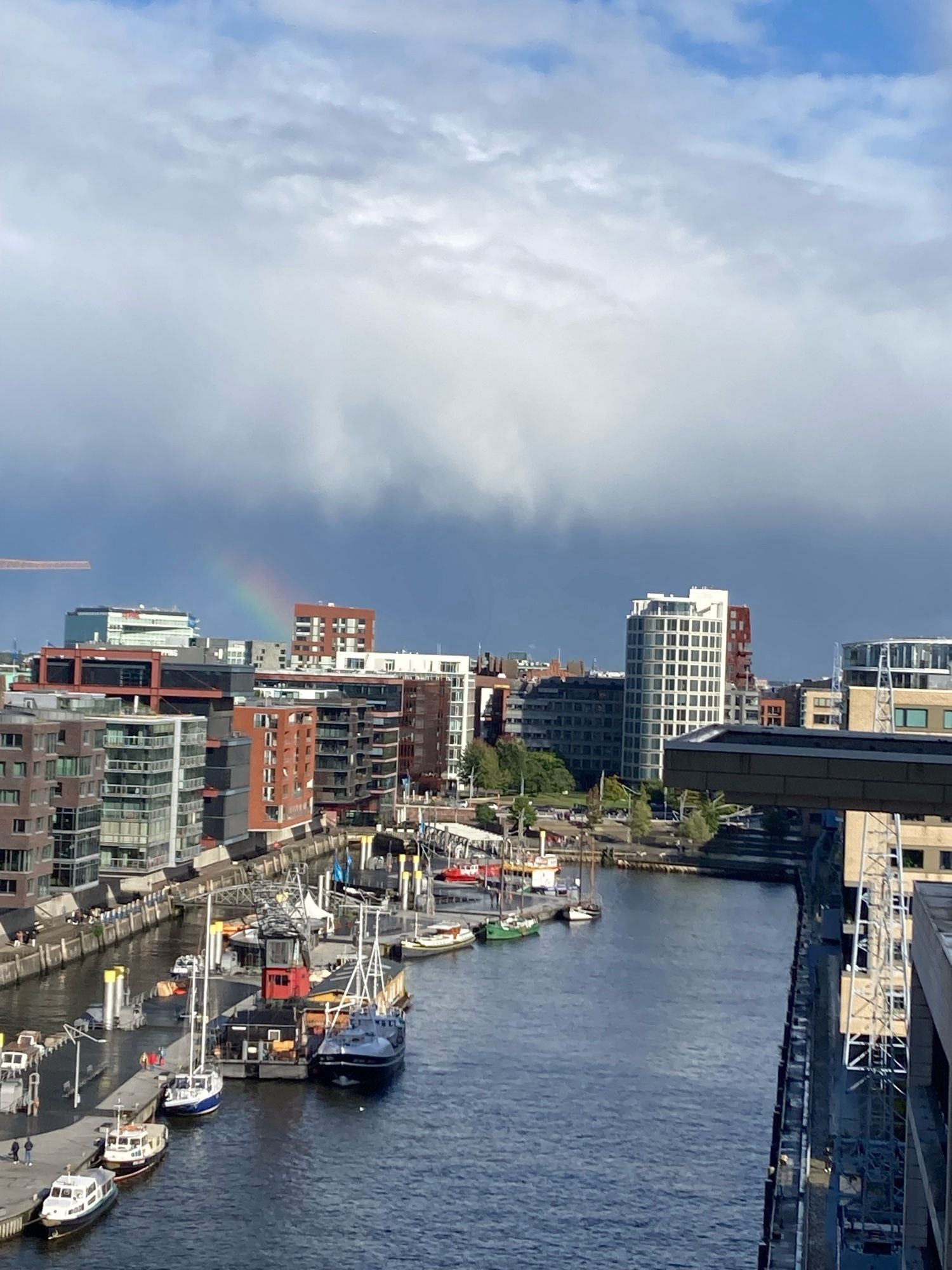 Beginning of a rainbow over the Hamburg harbour area