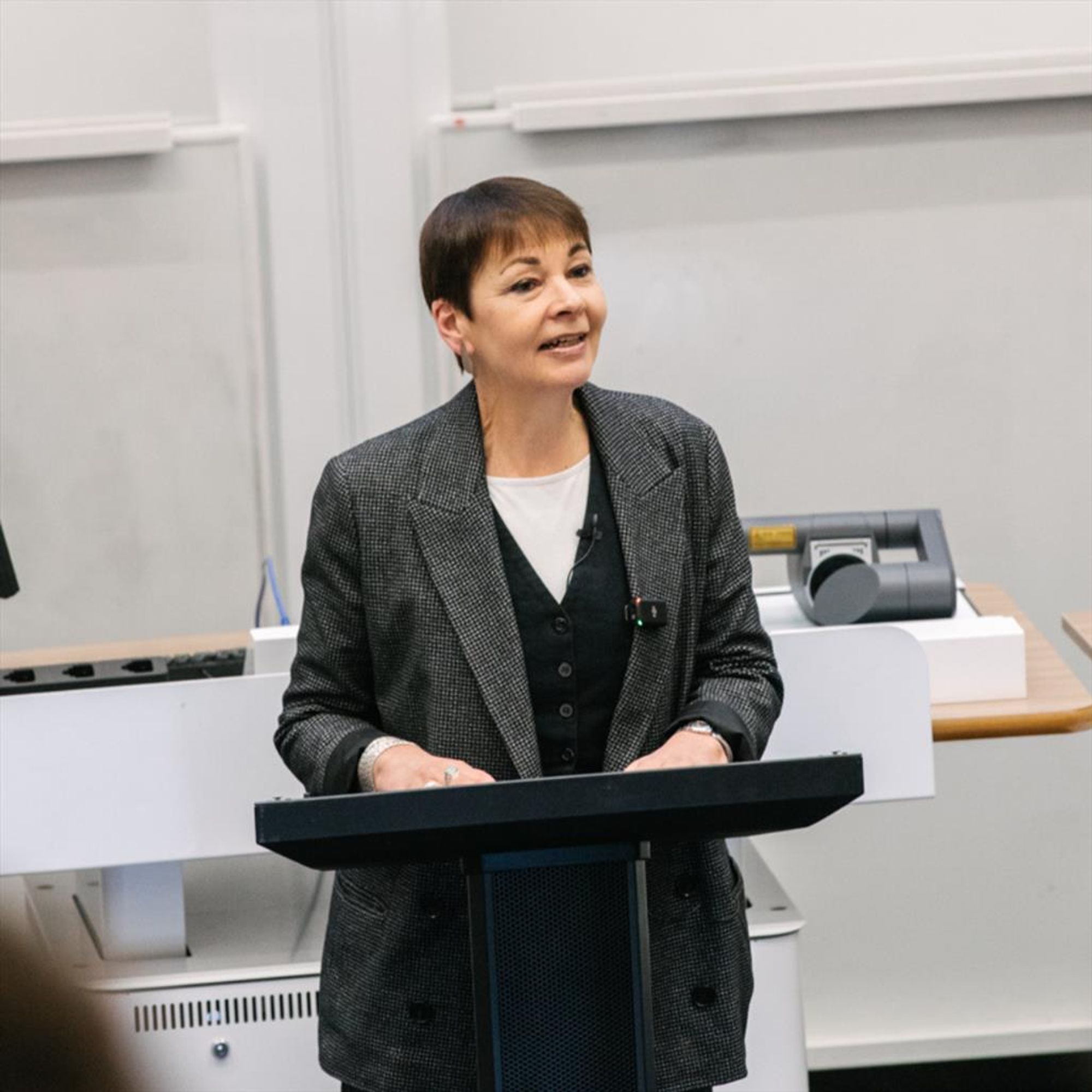 Photo of Caroline Lucas at a lectern delivering the Lancaster Environment Lecture 2024. Photo taken by Ginny Koppenhol.