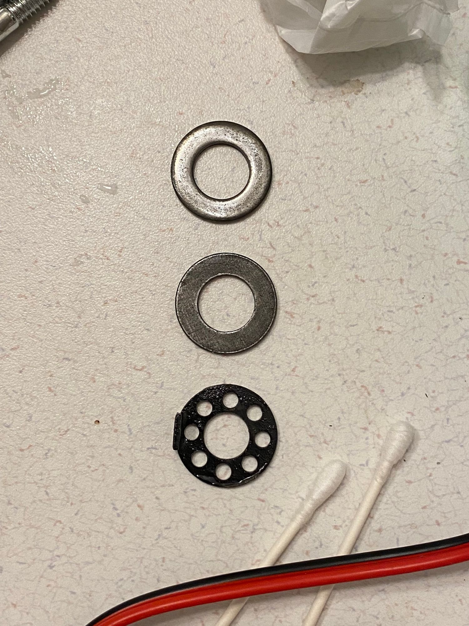 the same washers, the top side looks shinier now, bottom looks about the same. total 10 minutes, 5 per side with a bunch of rotation and agitation 