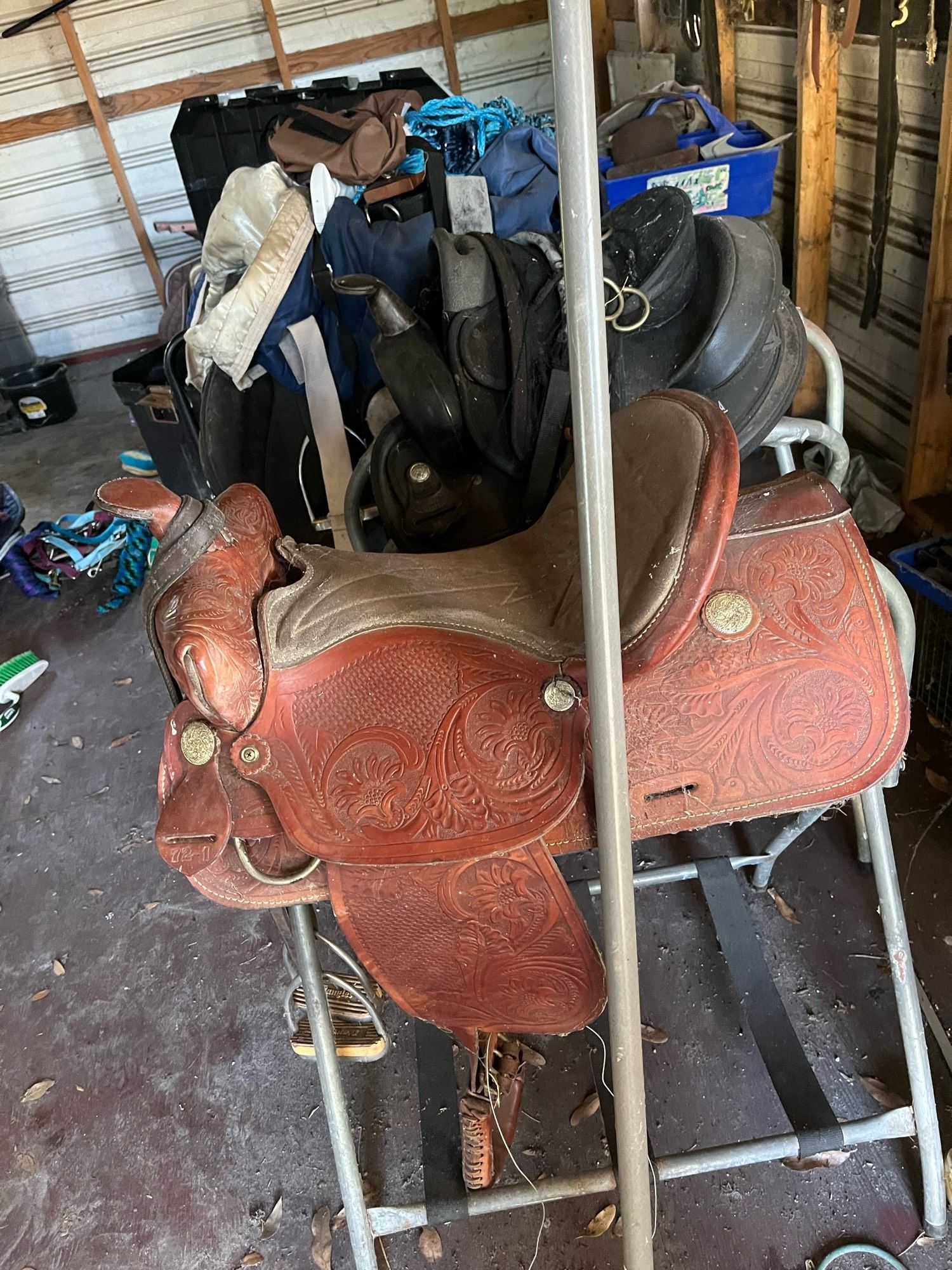 Intricate patterned chestnut leather saddle