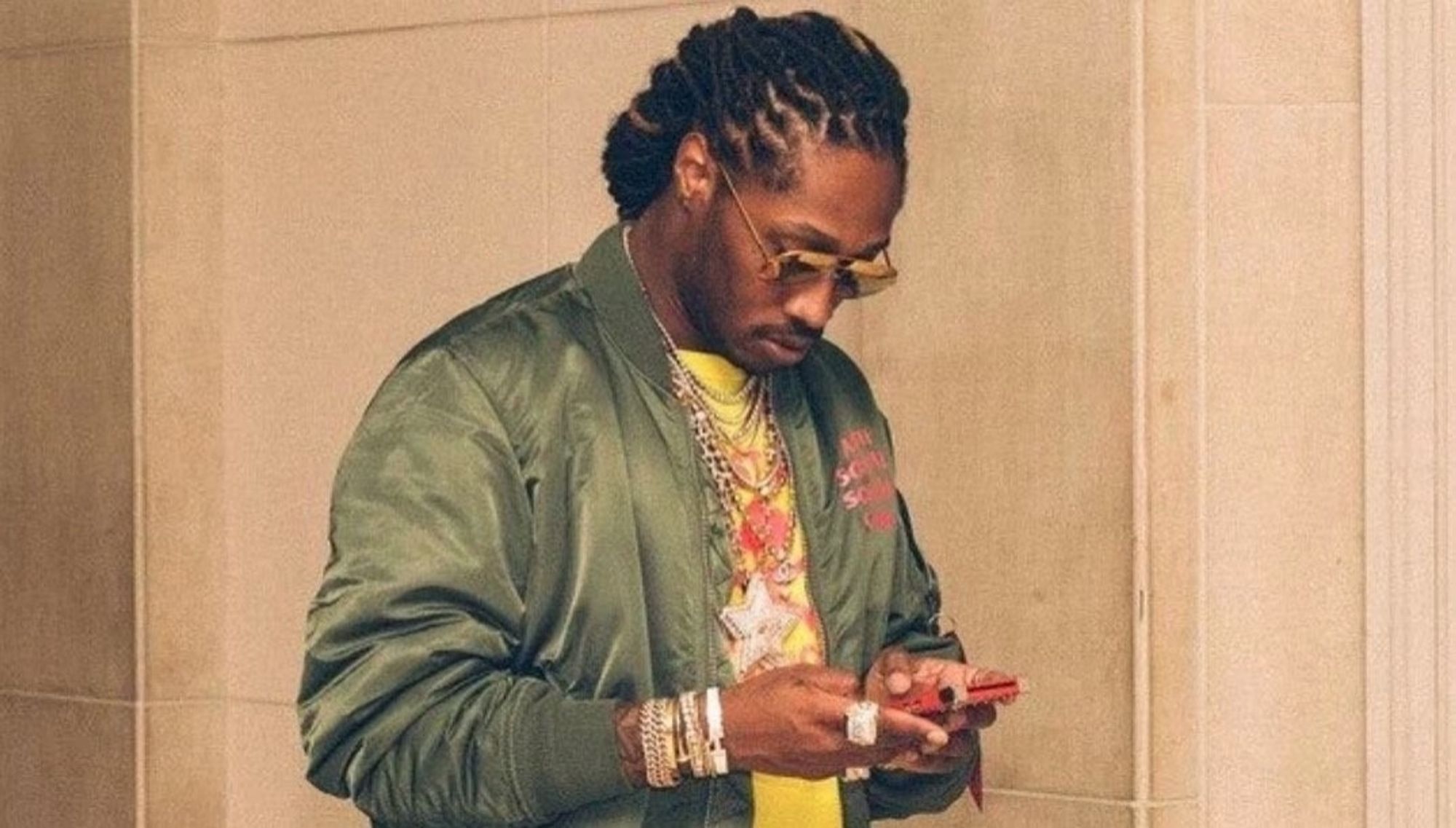 Future looking down at his phone while texting meme.