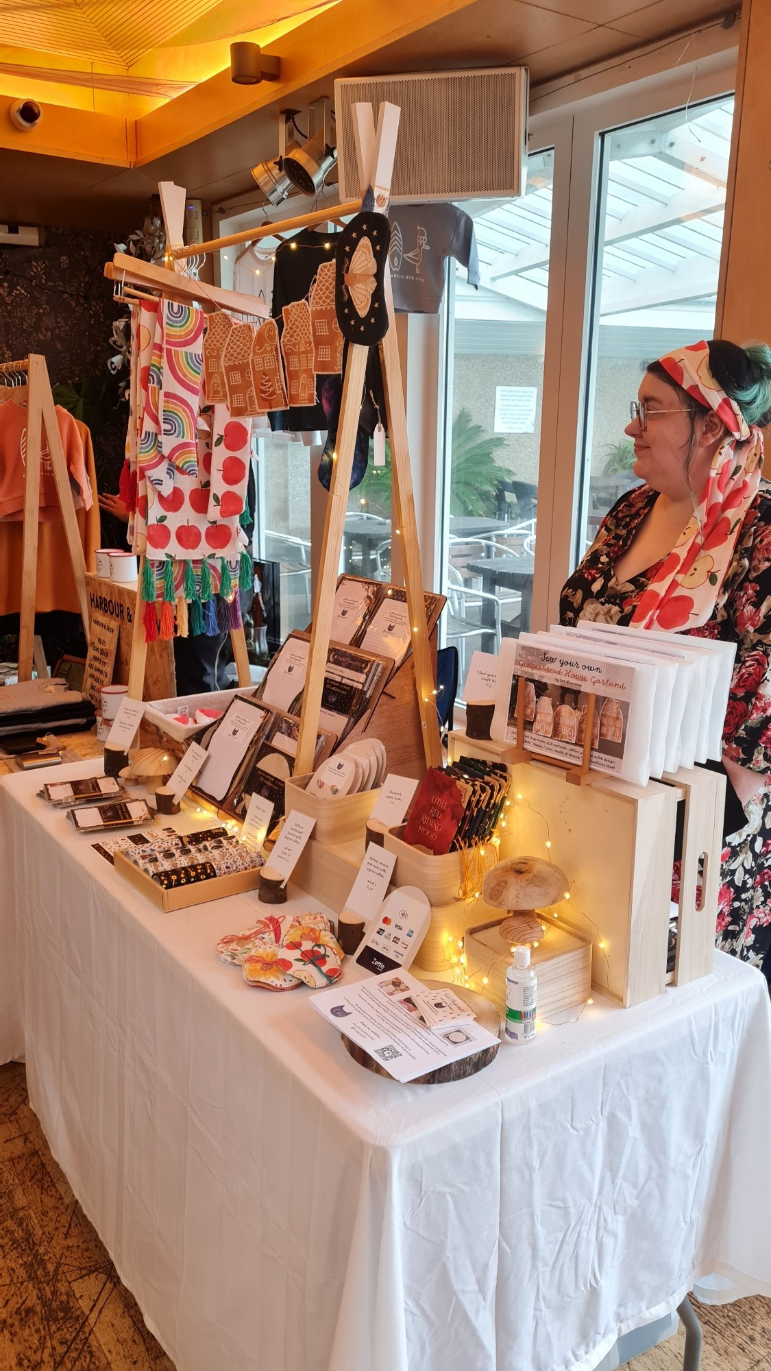 Designer with her market stall - face masks, stationery, washi tape, scarves and other fabric items