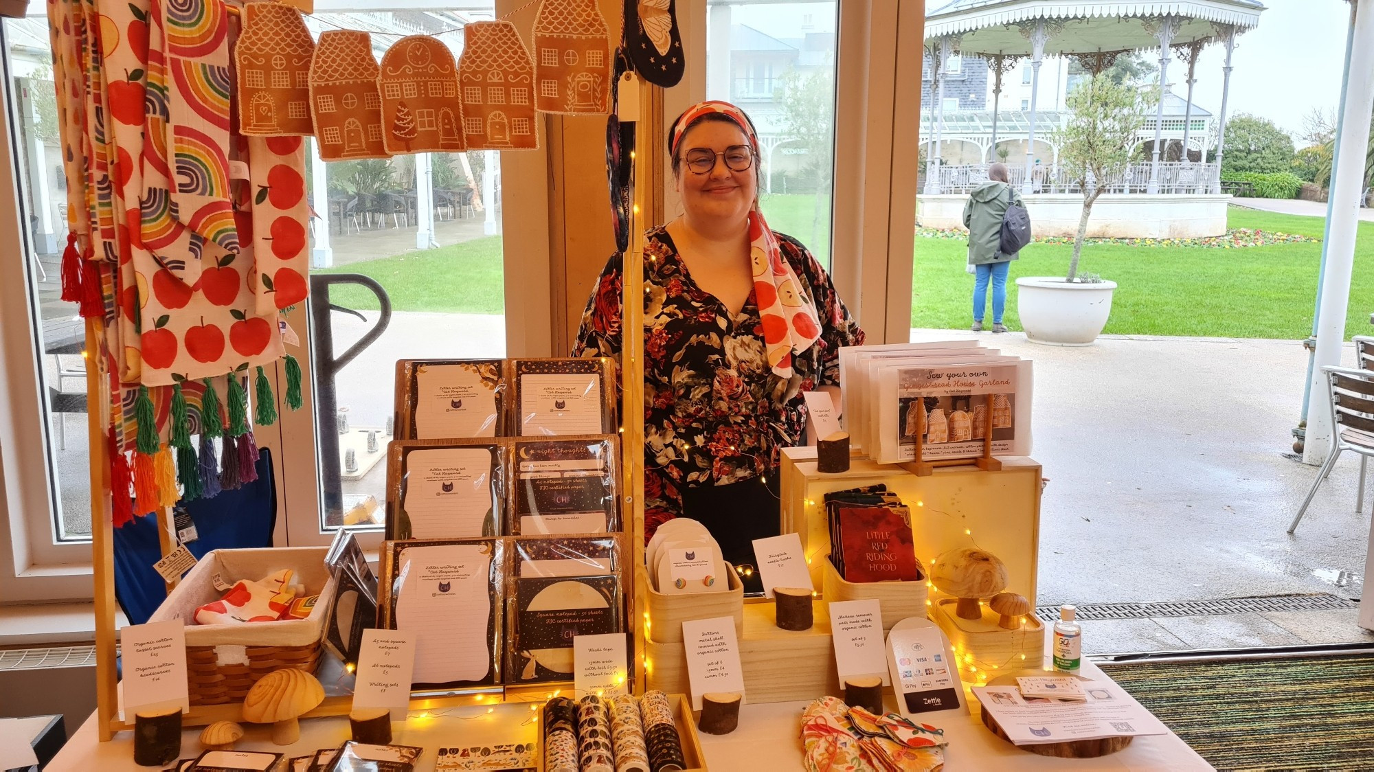 Designer with her market stall - face masks, stationery, washi tape, scarves and other fabric items