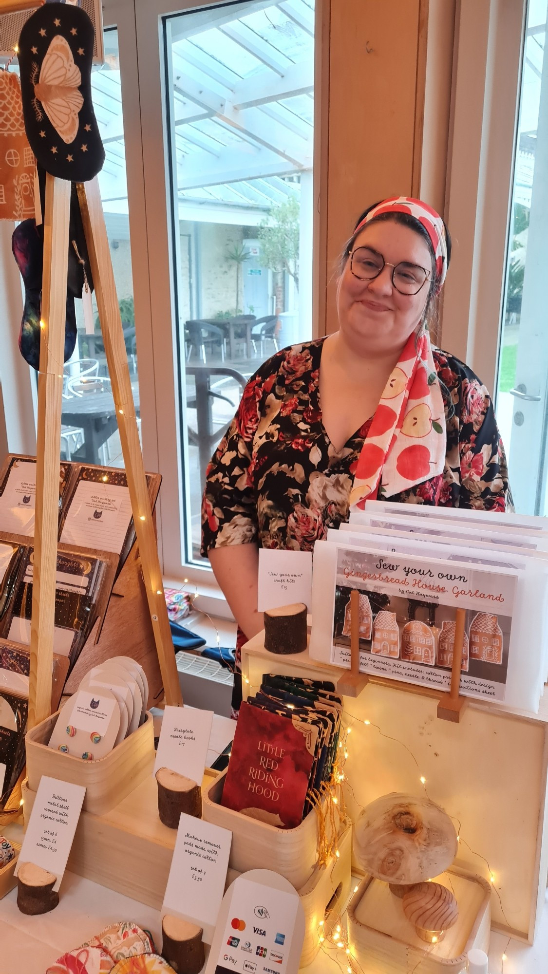 Designer with her market stall - face masks, stationery, washi tape, scarves and other fabric items