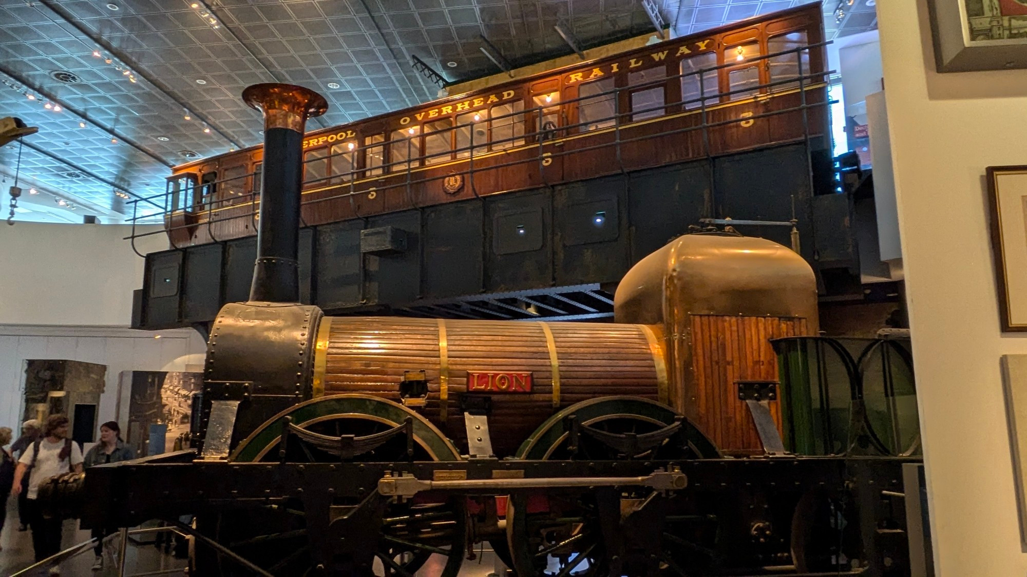 Locomotive 'Lion', one of the competitors at the legendary Rainhill Trials in 1829, now to be found in the Museum of Liverpool Life.  In between times, it did service as a docks engine, restored and mounted on a plinth at Lime Street Station Liverpool in 1930 and starred as the titular train in 'The Titfield Thunderbolt'.