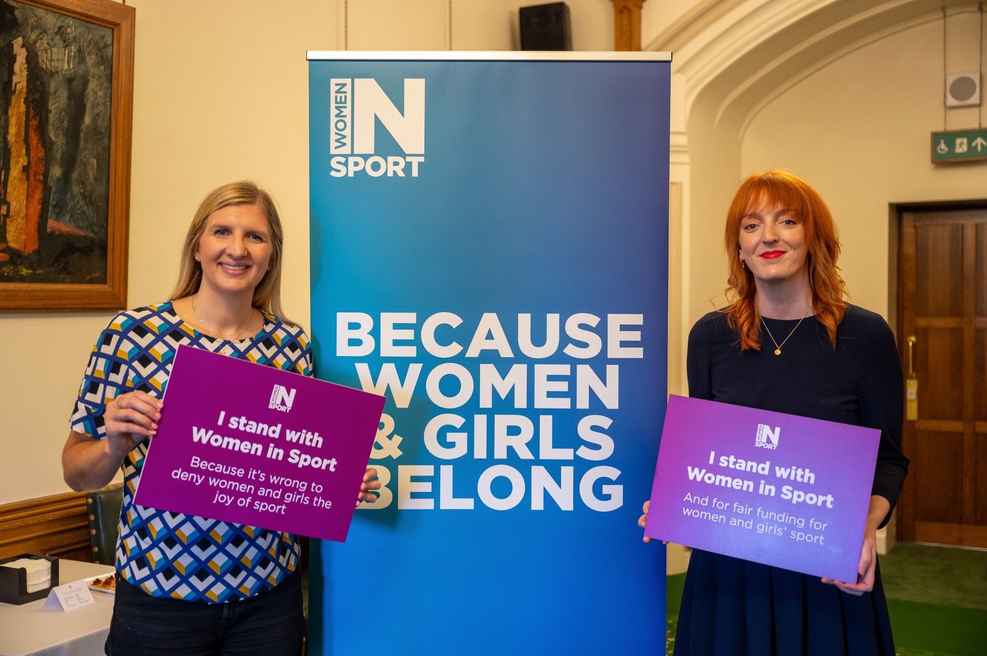 With Dame Rebecca Adlington OBE, both holding signs saying "I stand with Women in Sport"