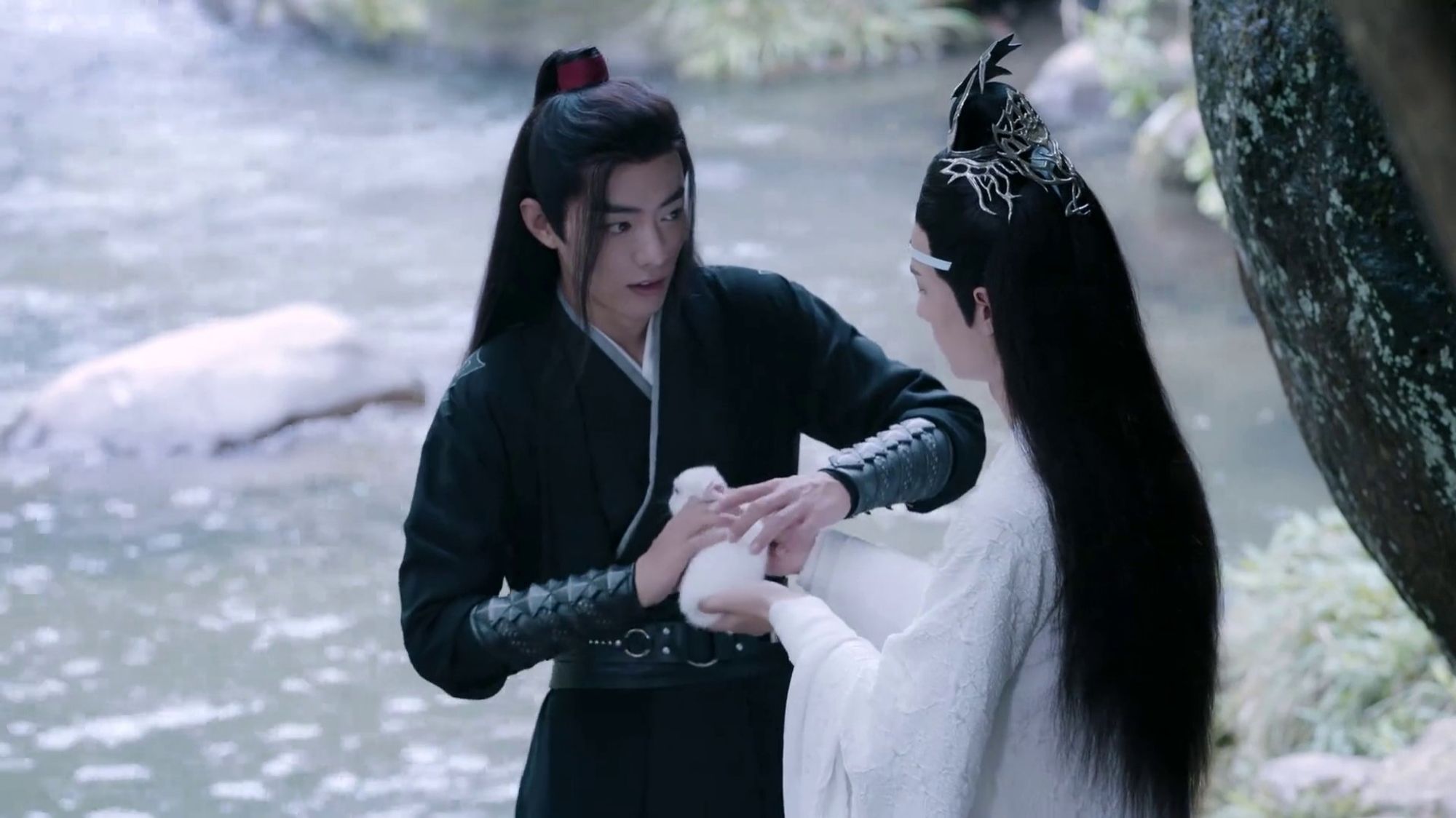 Wei Wuxian (actor Xiao Zhan) & Lan Wangji (actor Wang Yibo) holding a white rabbit in The Untamed / CQL