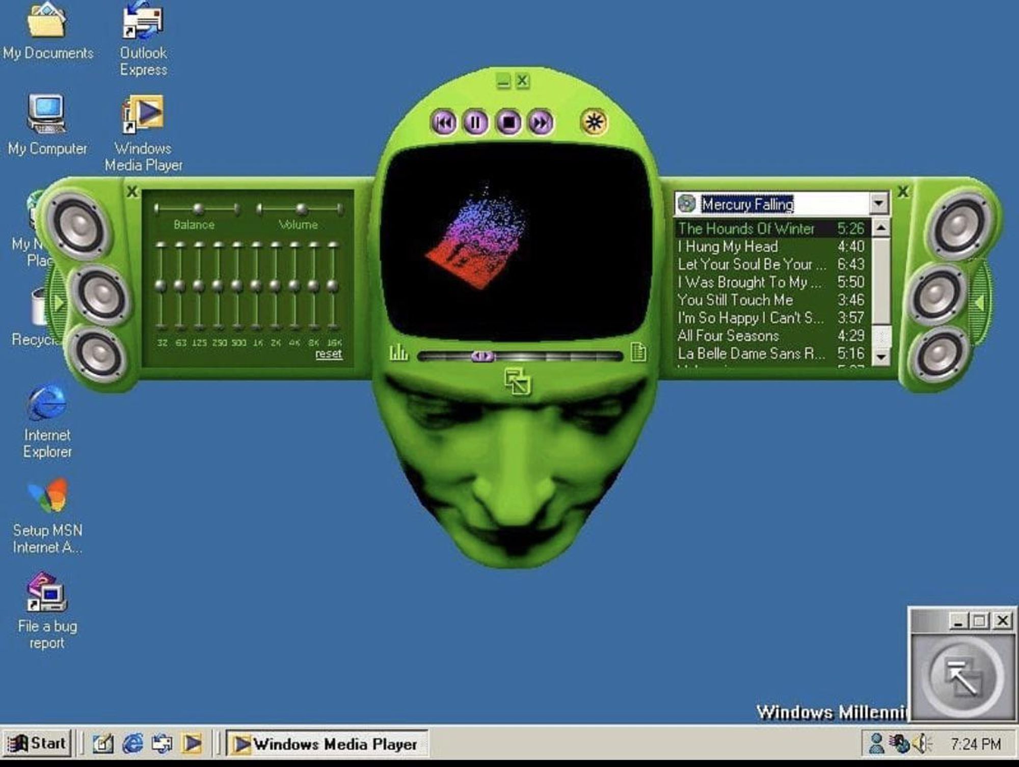 Print do Windows Media Player 7, em sua famosa skin "Headspace", uma cabeça verde, olhando para baixo. Em sua "testa", os controles do player e uma tela cujas bordas lembram a forma de uma TV de tubo; no lugar das orelhas, duas partes retráteis, com autofalantes em suas extremidades: à esquerda, um equalizador; à direita, uma playlist.