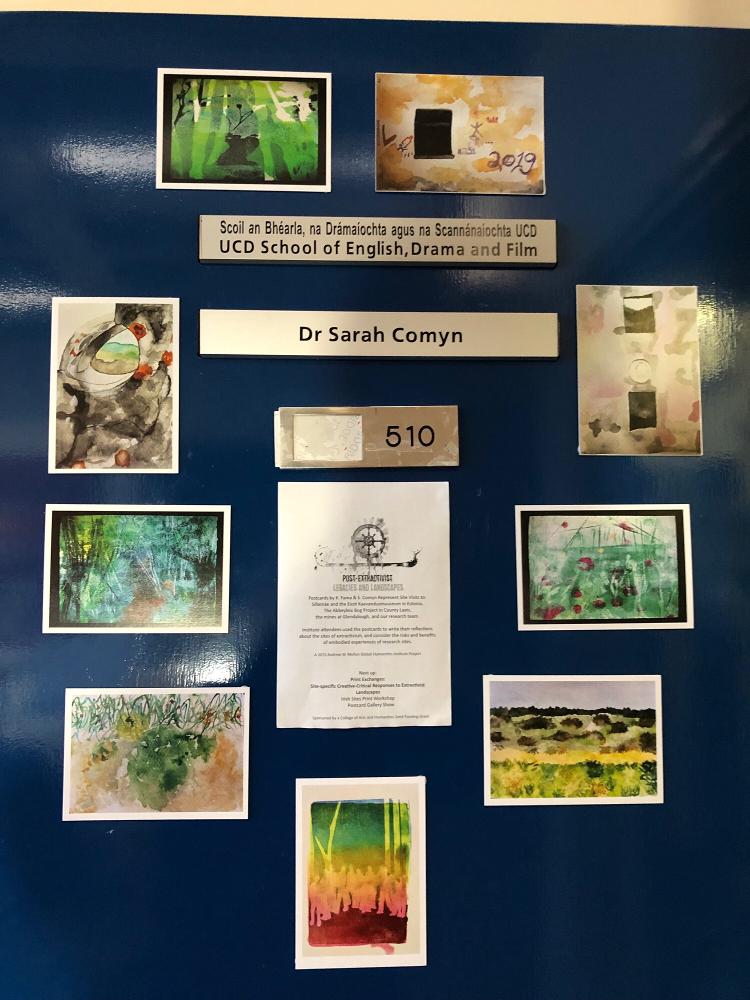 Office door with postcards of watercolour paintings and gelli prints of extractivist sites in Estonia and Ireland