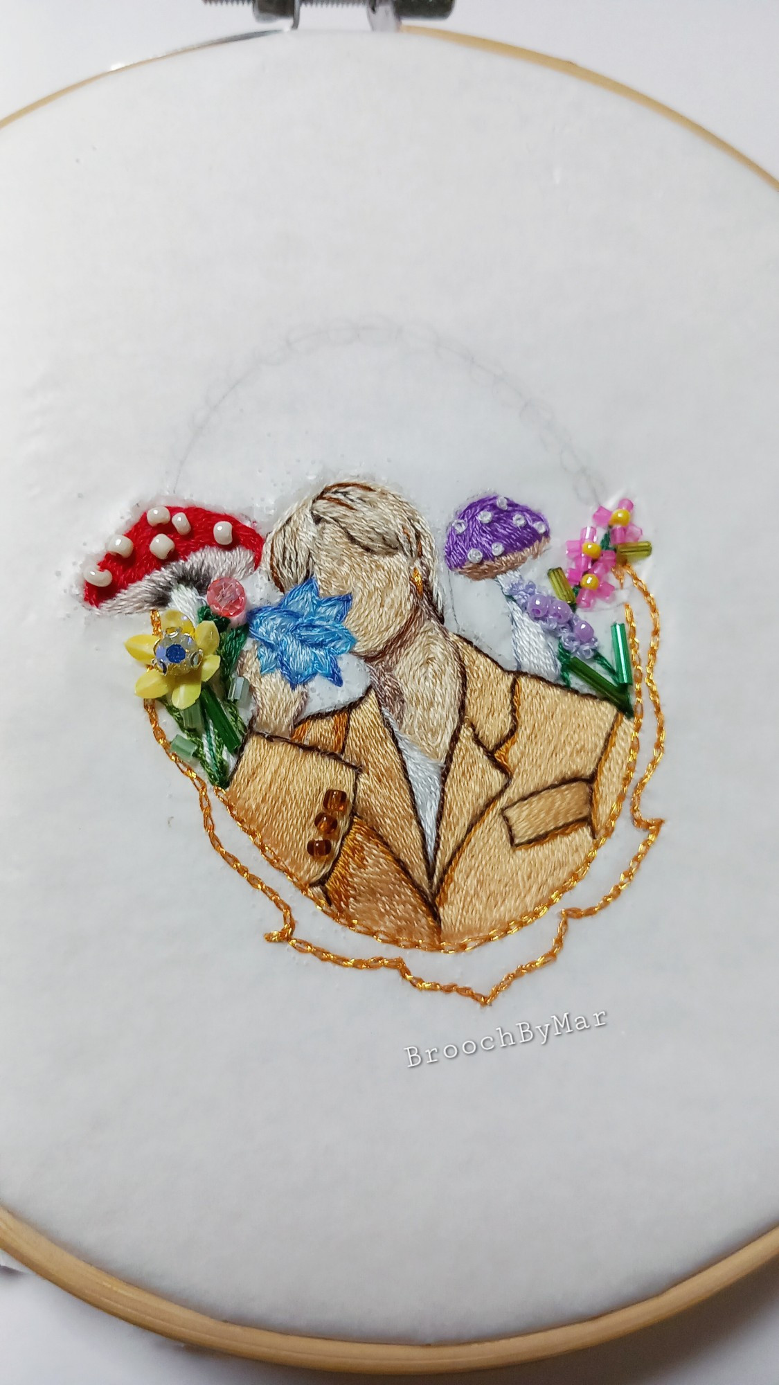 Work in progress of an embroidery brooch inspired by BTS Jimin's album Muse and his song Smeraldo Garden Marching Band. 