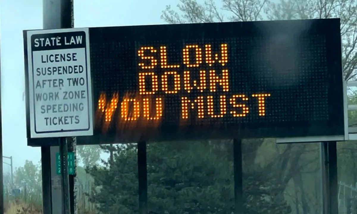 An electric NY Department of Transportation sign. The sign reads "SLOW DOWN YOU MUST" as a nod to the speech patterns of the Star Wars character Yoda, in celebration of "May the Fourth... be with You".
