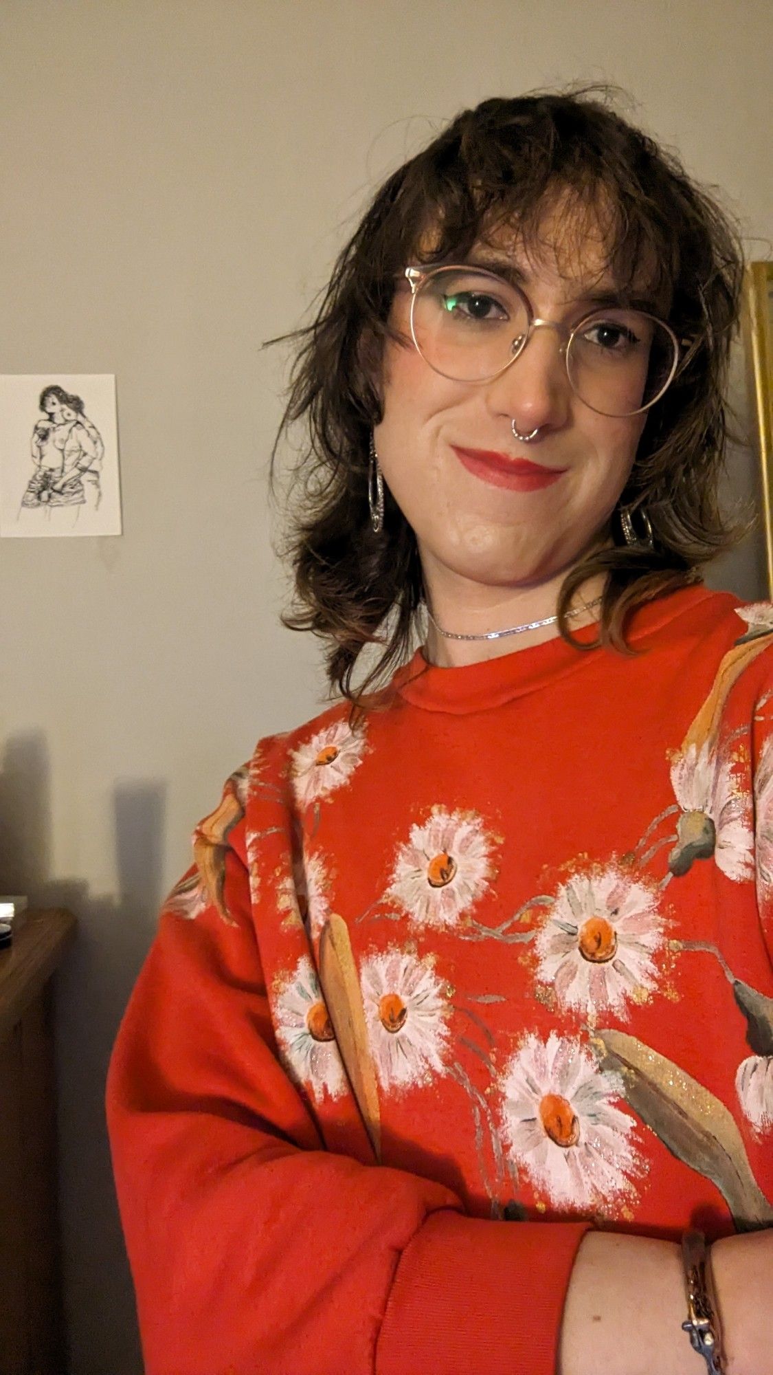 Woman in red jumper with eucalyptus on it